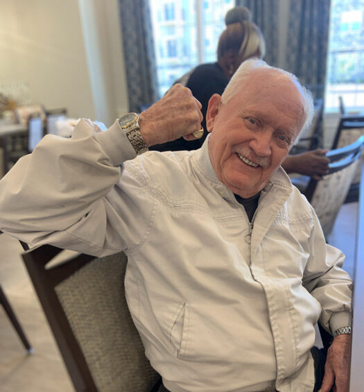 Senior resident smiling in a common area