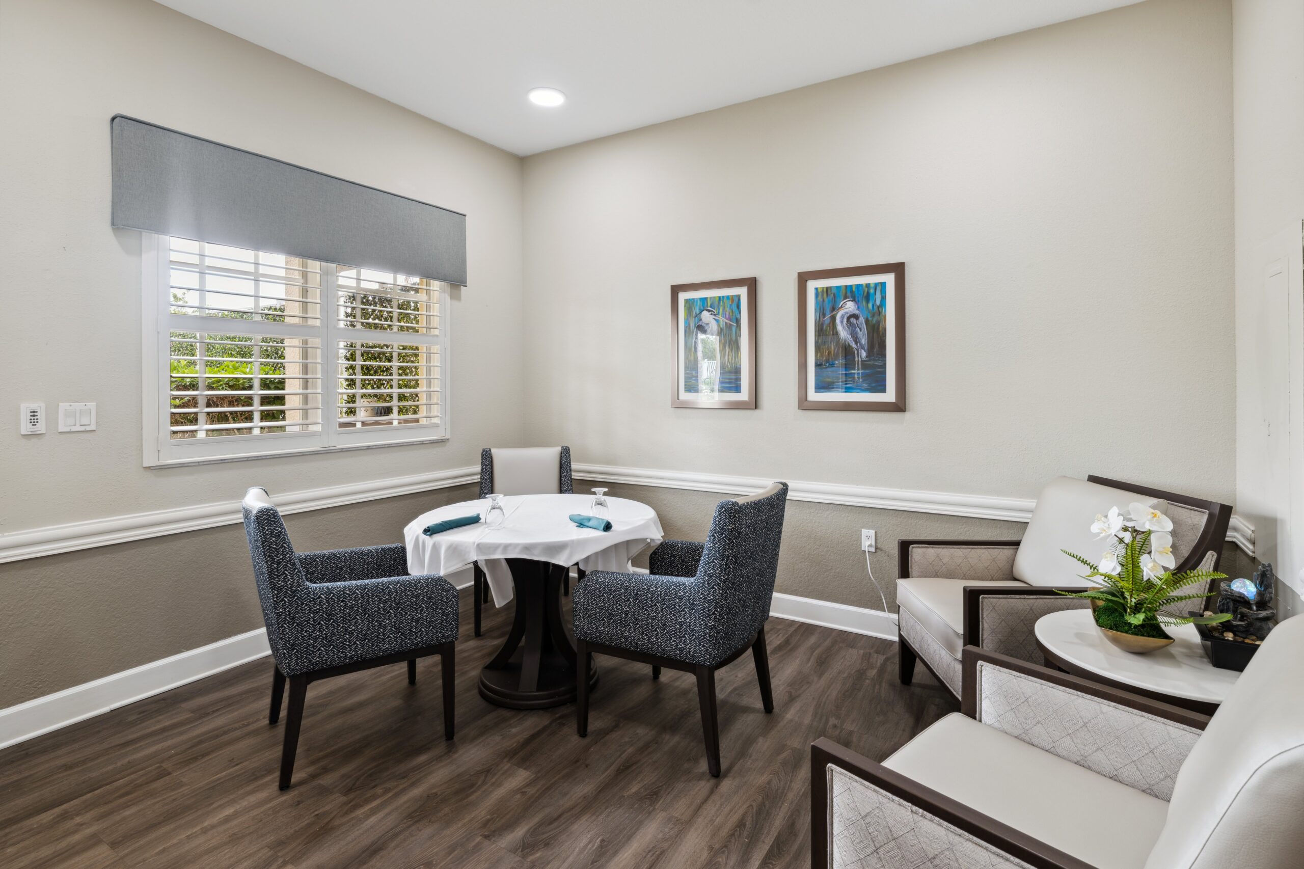 Bright, inviting common area with seating and artwork