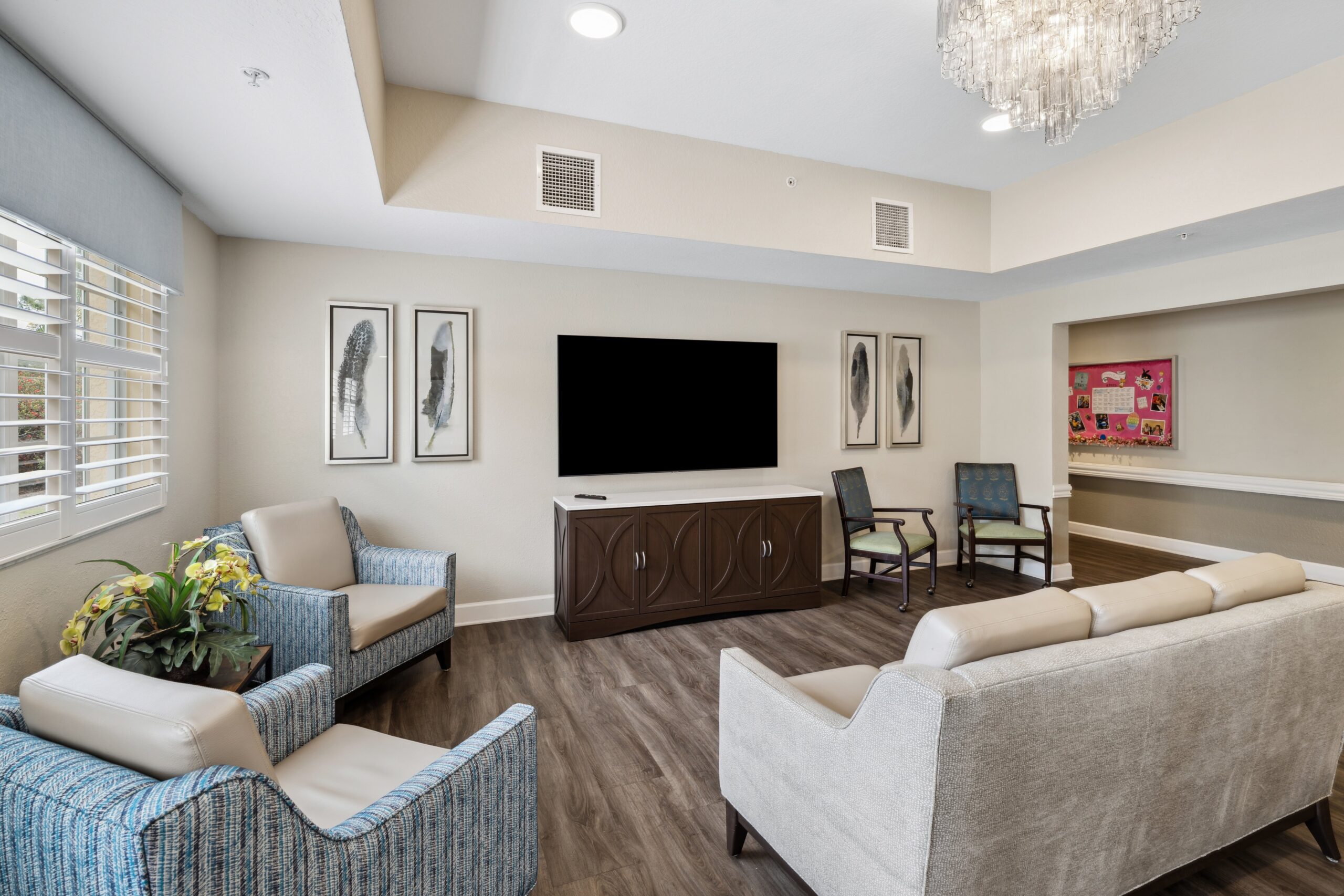 Bright common area with seating and a television