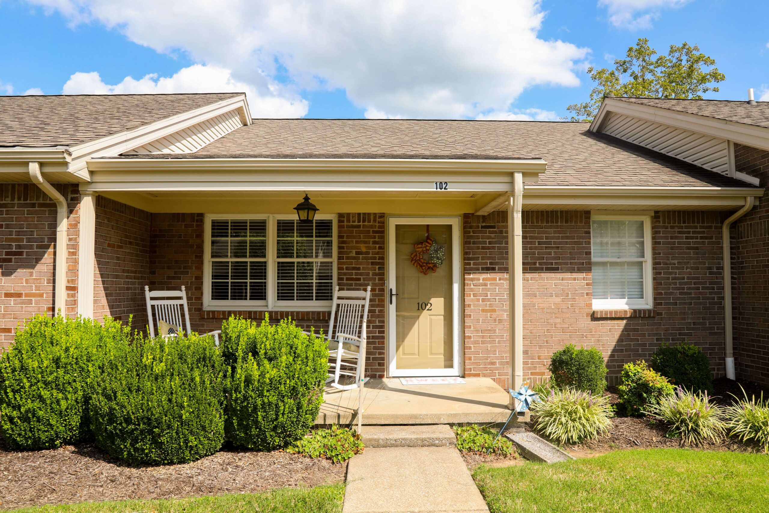 Front porch of a resident unit with rocking chairs