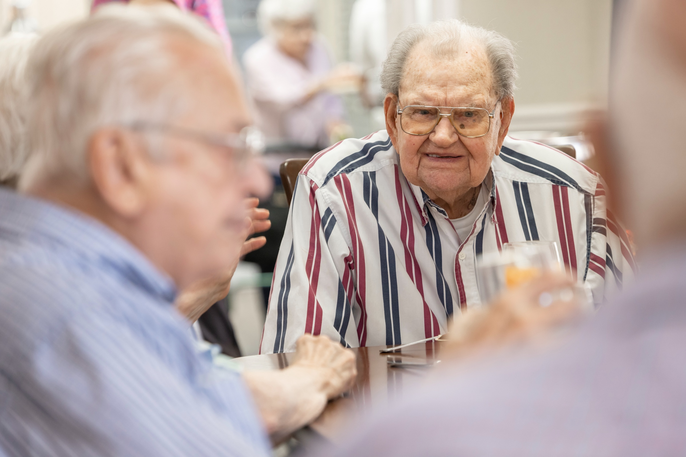 Residents engaging in conversation in a common area