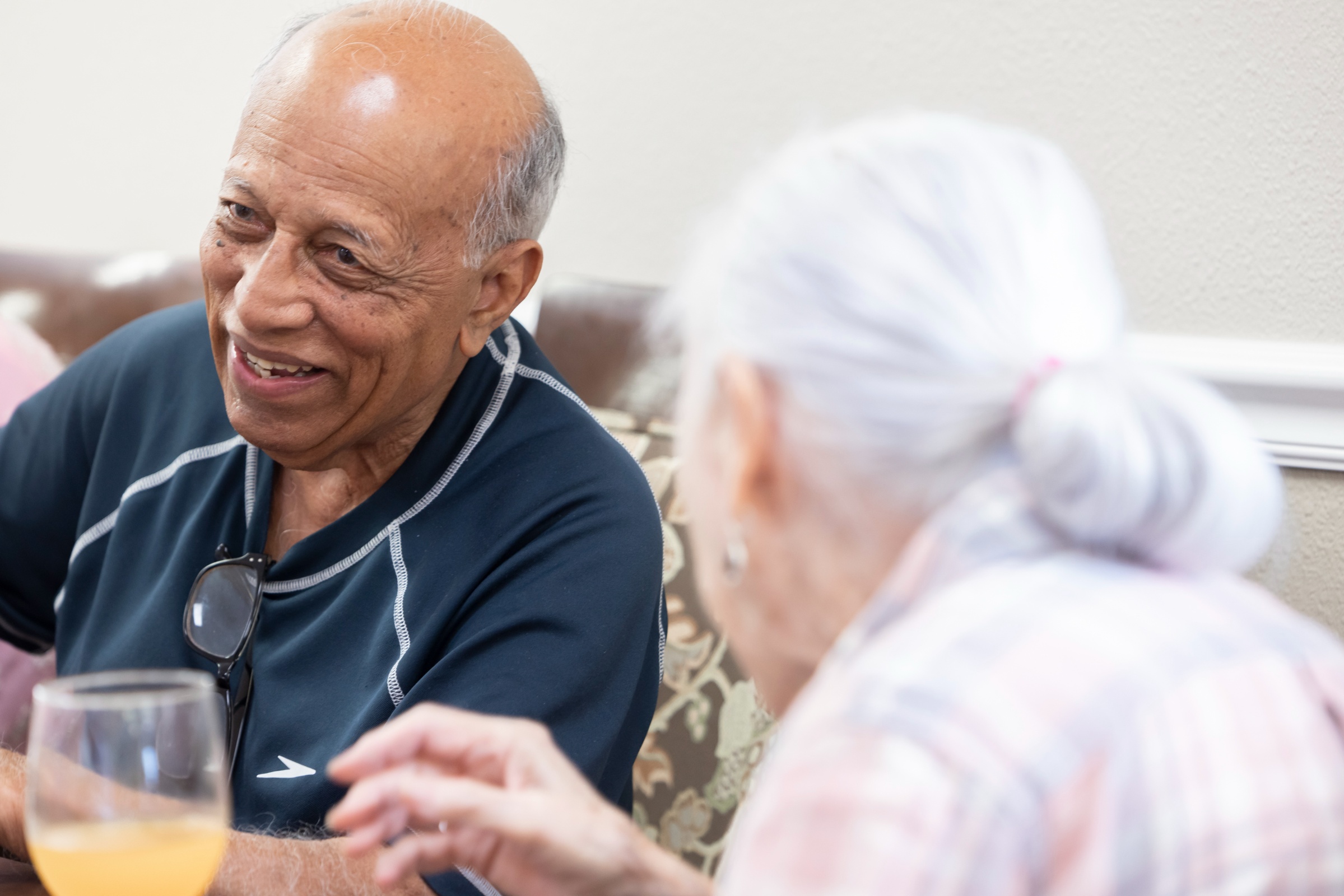Residents enjoying conversation in a cozy common area