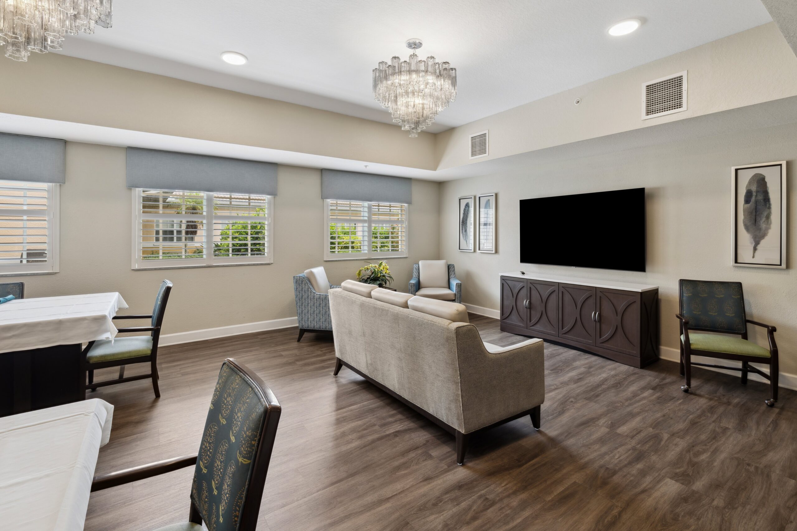 Bright interior common area with seating and windows