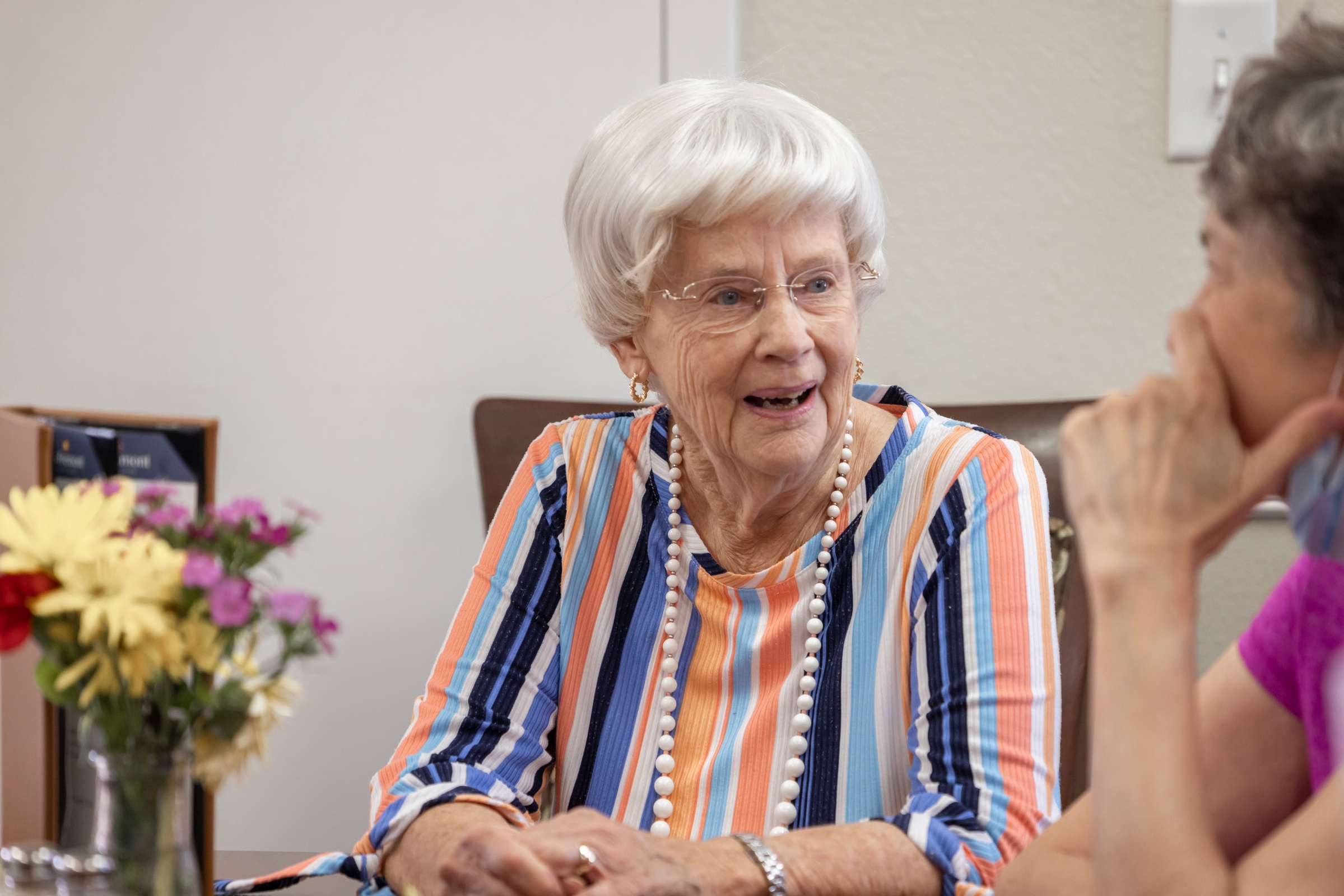 Residents enjoying a conversation in a common area