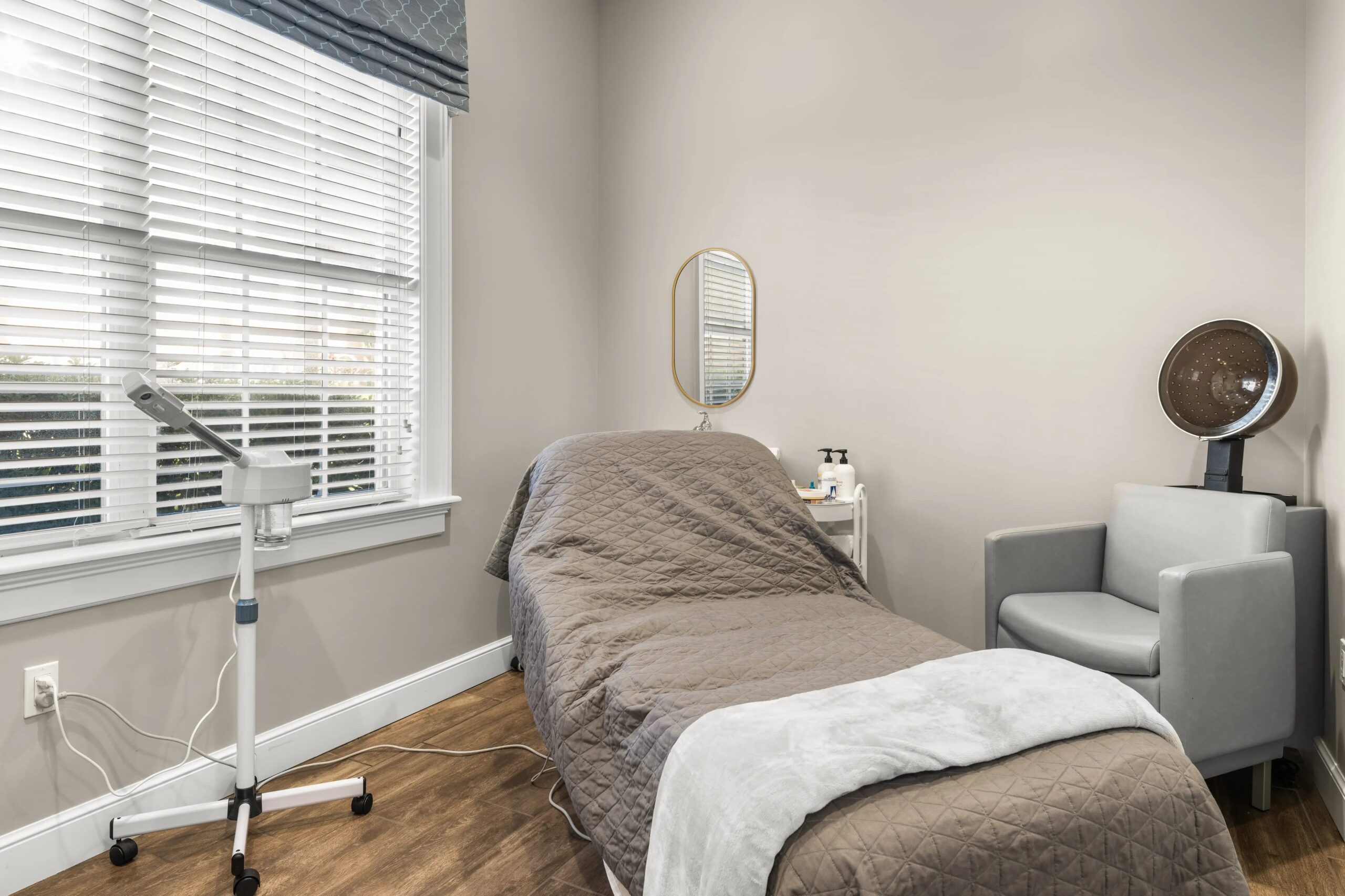 Interior view of a treatment room with a massage table