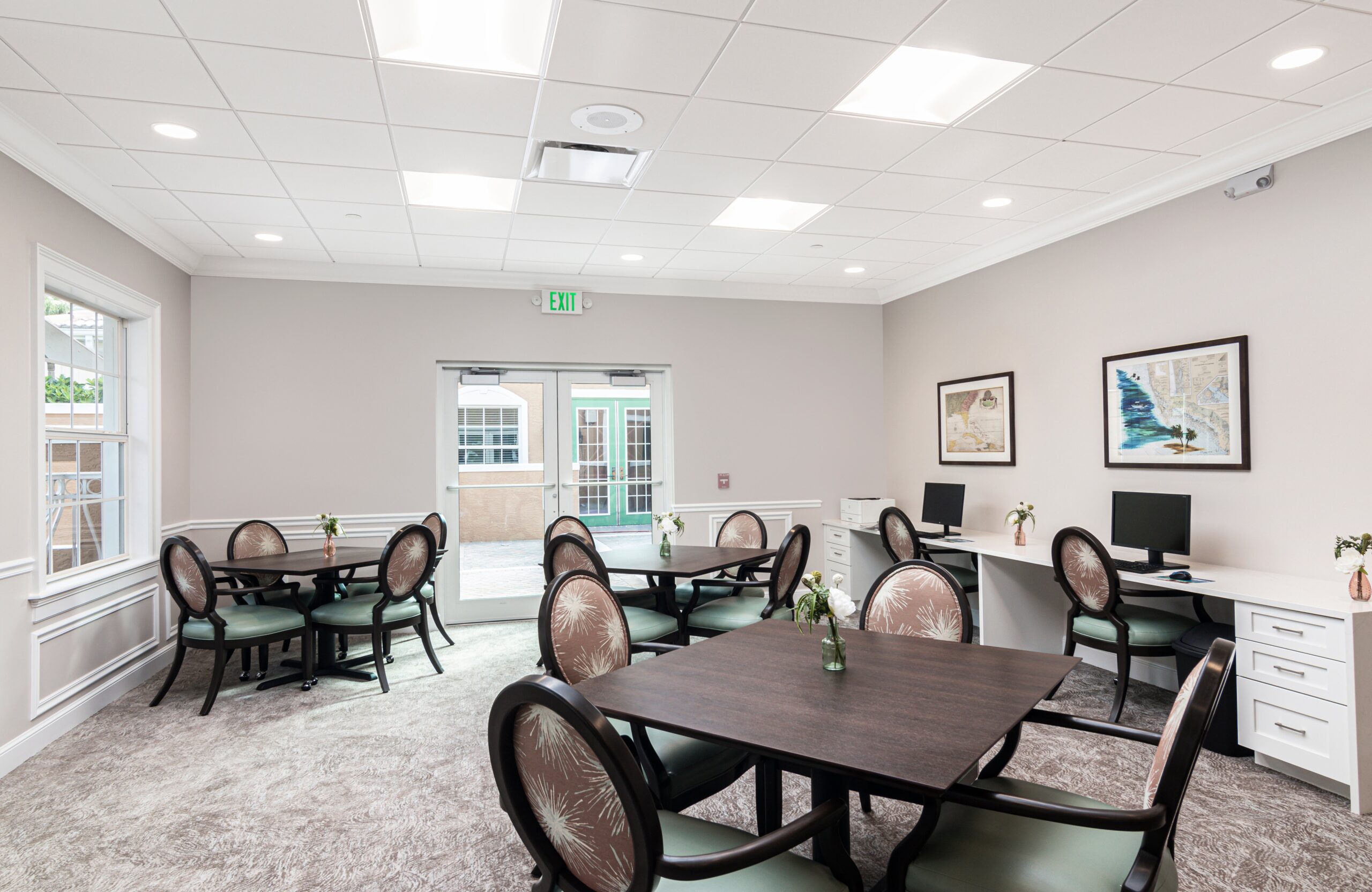 Bright activity room with tables and chairs
