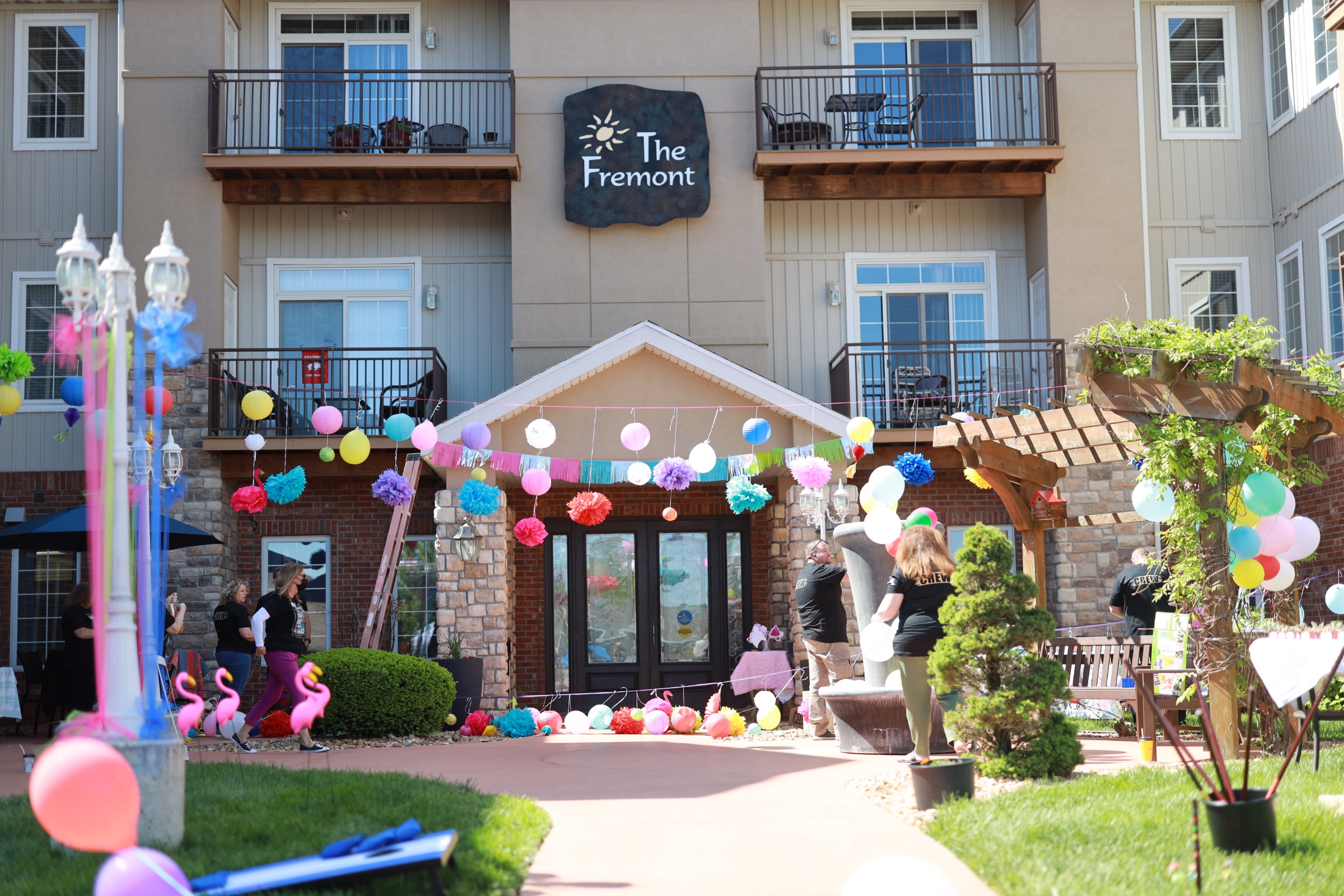 Residents celebrating with decorations outside the facility