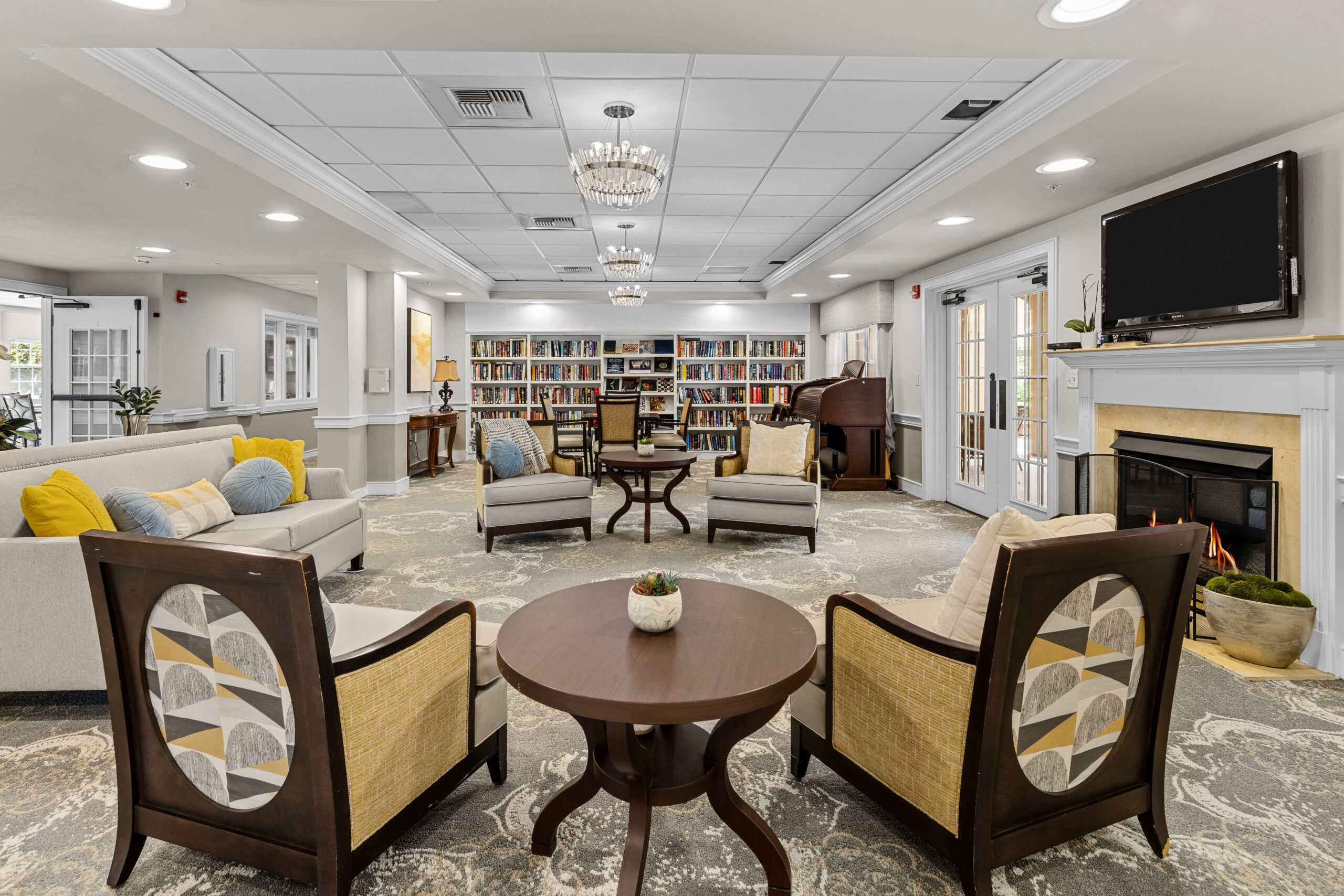 Bright common area with seating and bookshelves