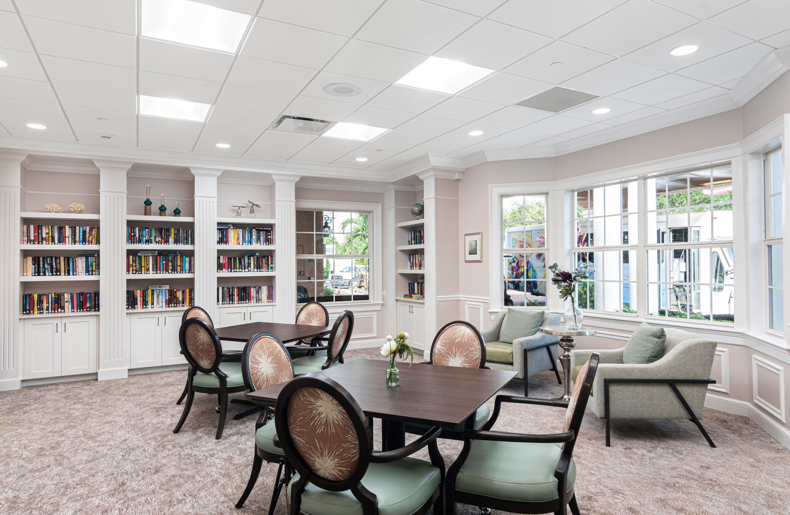 Bright common area with bookshelves and seating