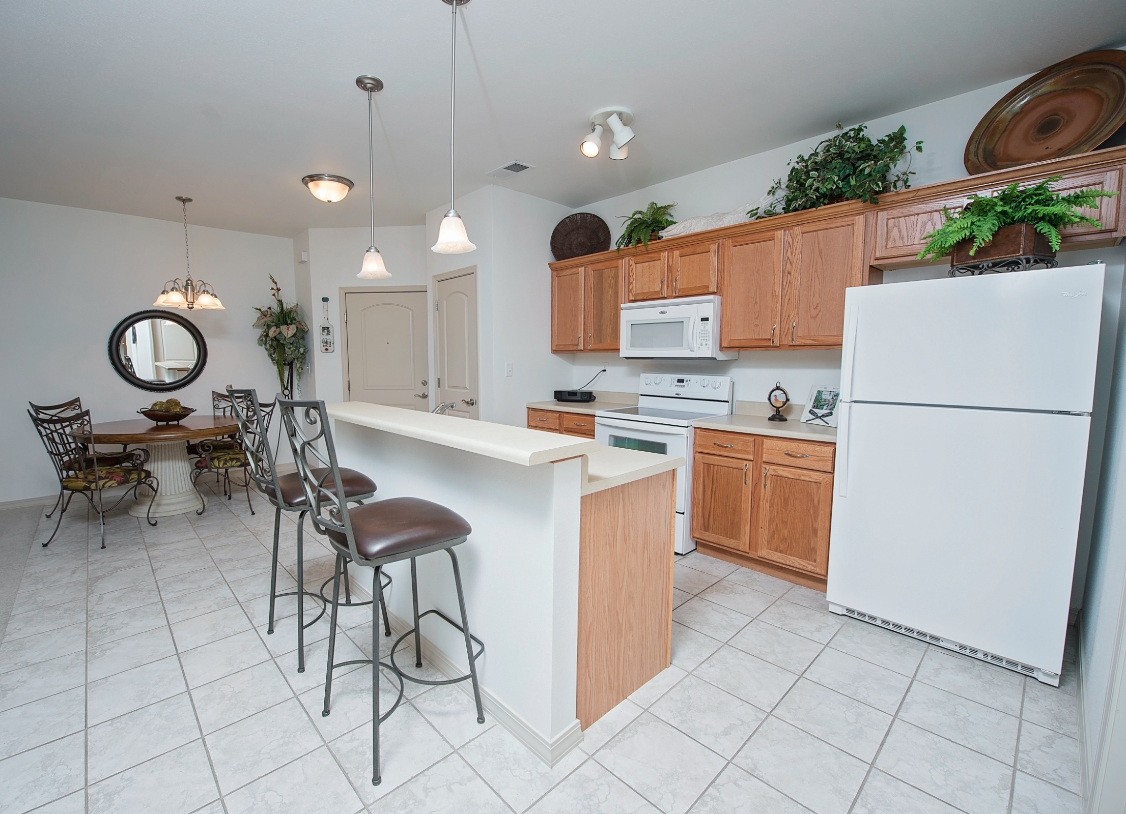 Bright kitchen space with dining area and modern appliances.
