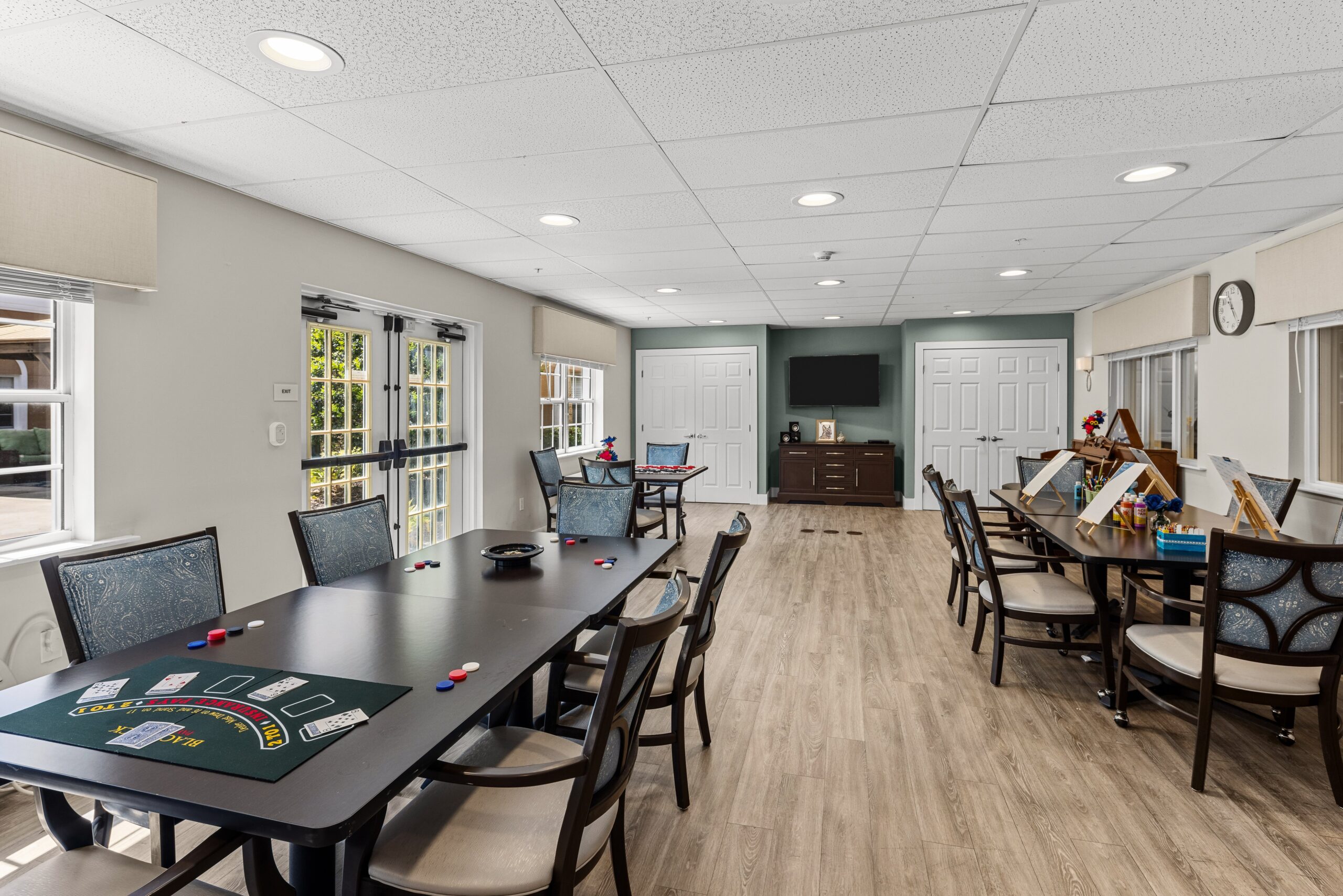 Interior activity room with tables and games
