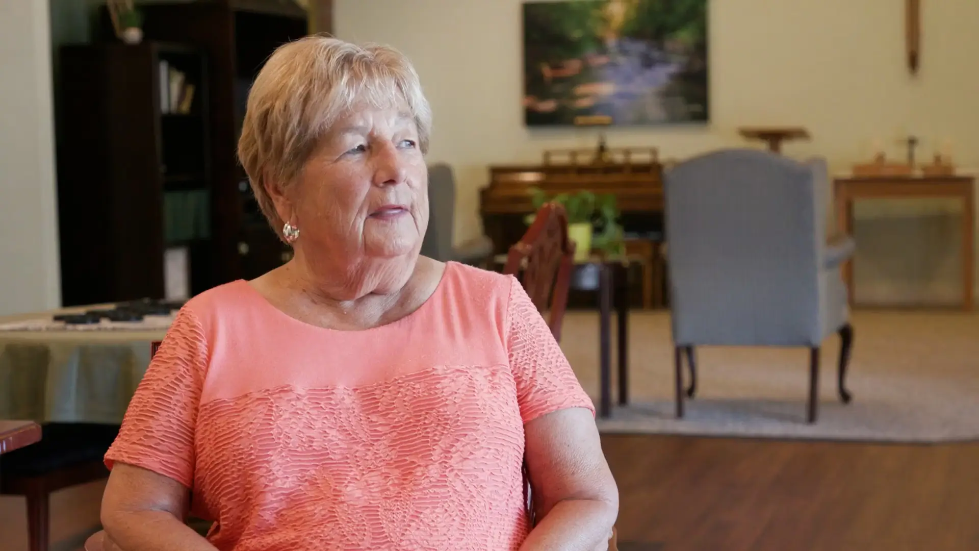 Resident sitting in a common area of the facility