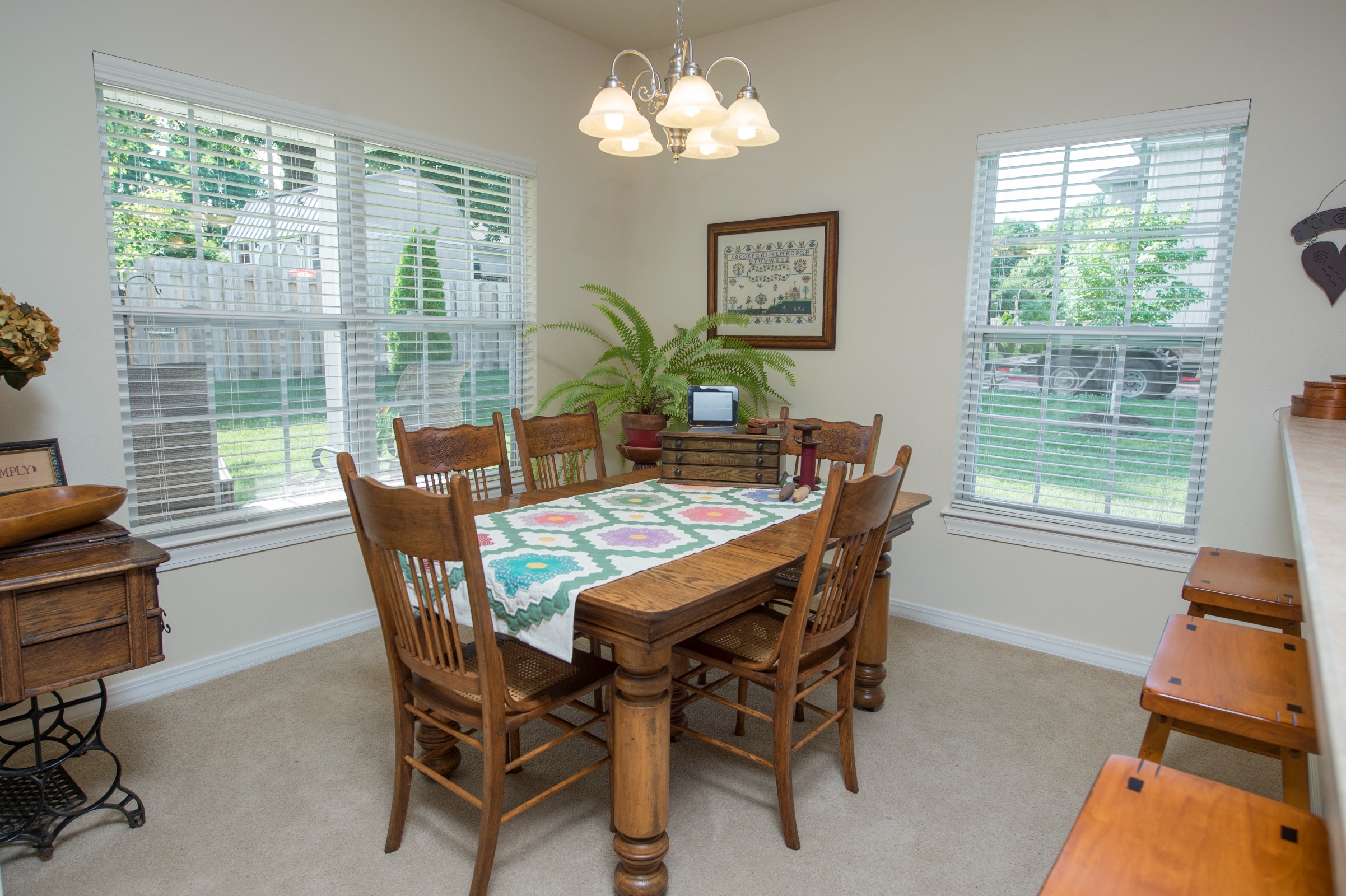 Bright dining area with wooden furniture and windows