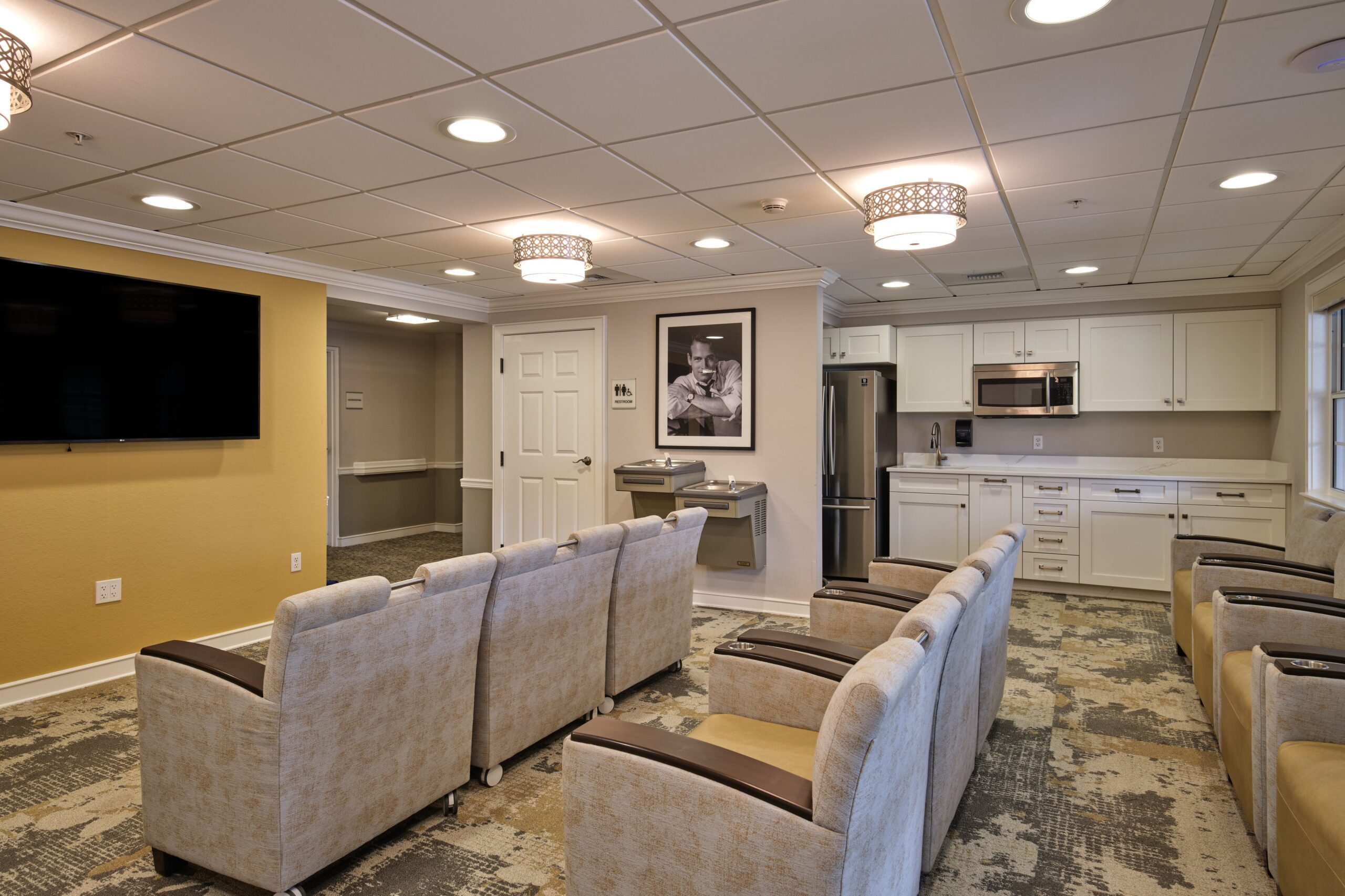 Interior lounge area with seating and kitchenette