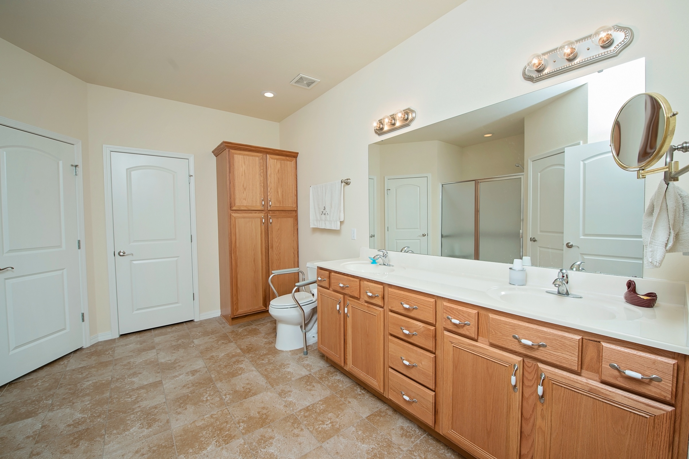Clean and modern bathroom with wooden cabinets