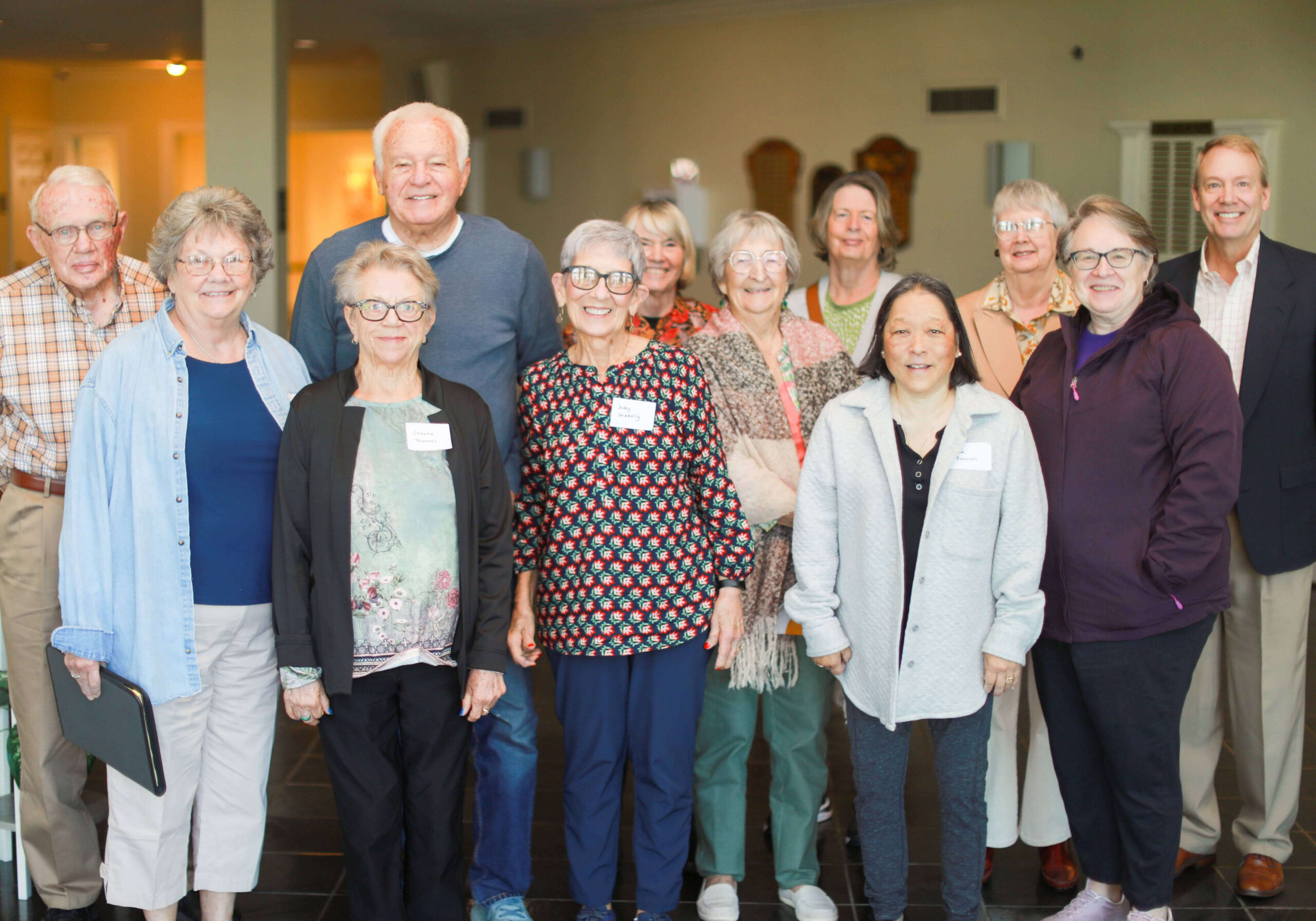 Group of residents and staff together in a common area