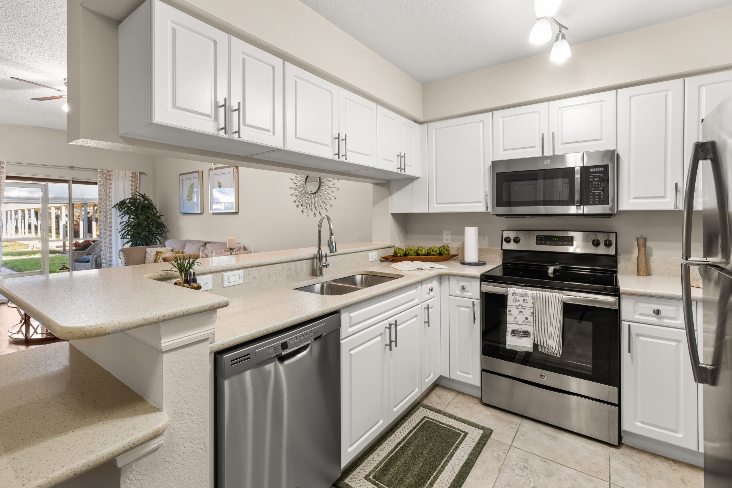 Bright kitchen area with modern appliances and decor