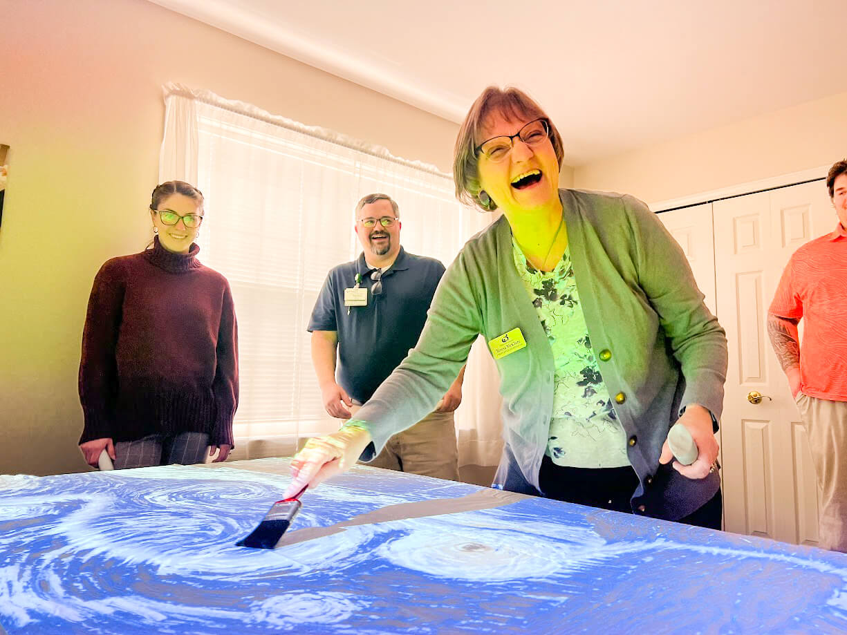 Residents and staff engaging in a creative activity