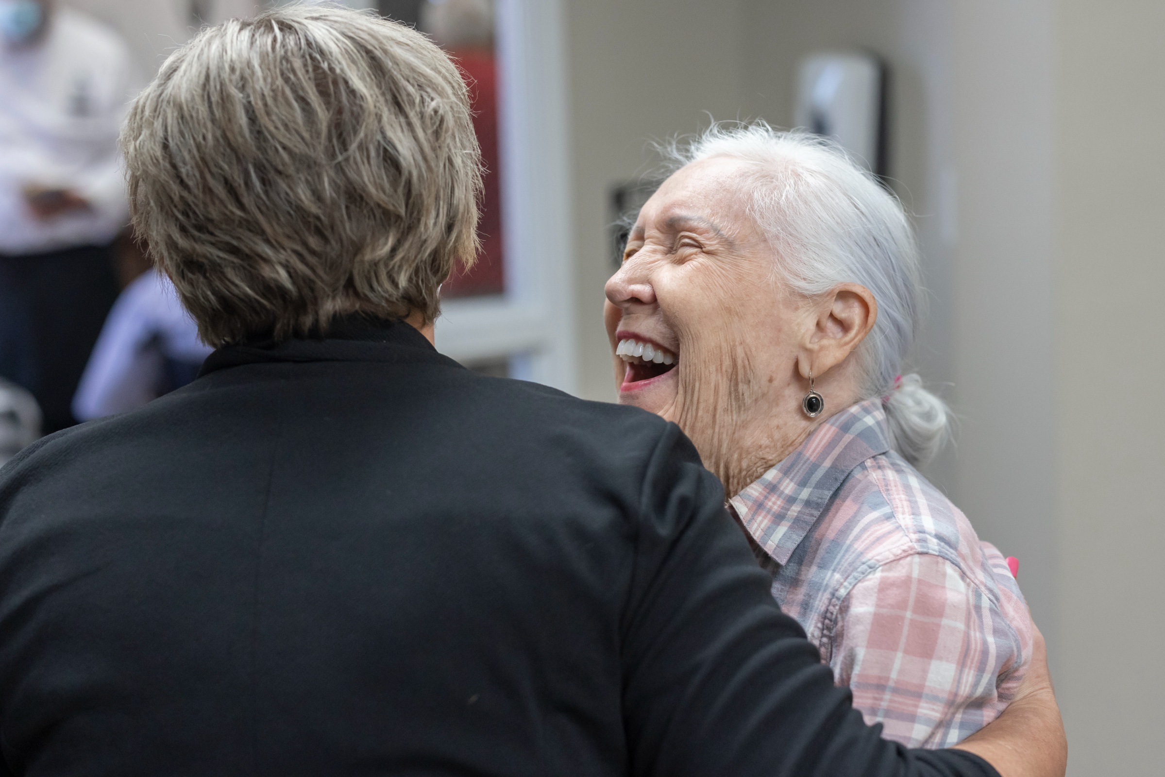 Residents sharing a joyful moment in a common area