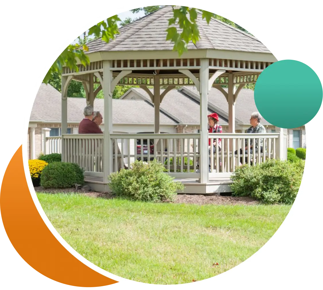 Residents enjoying conversation in a gazebo