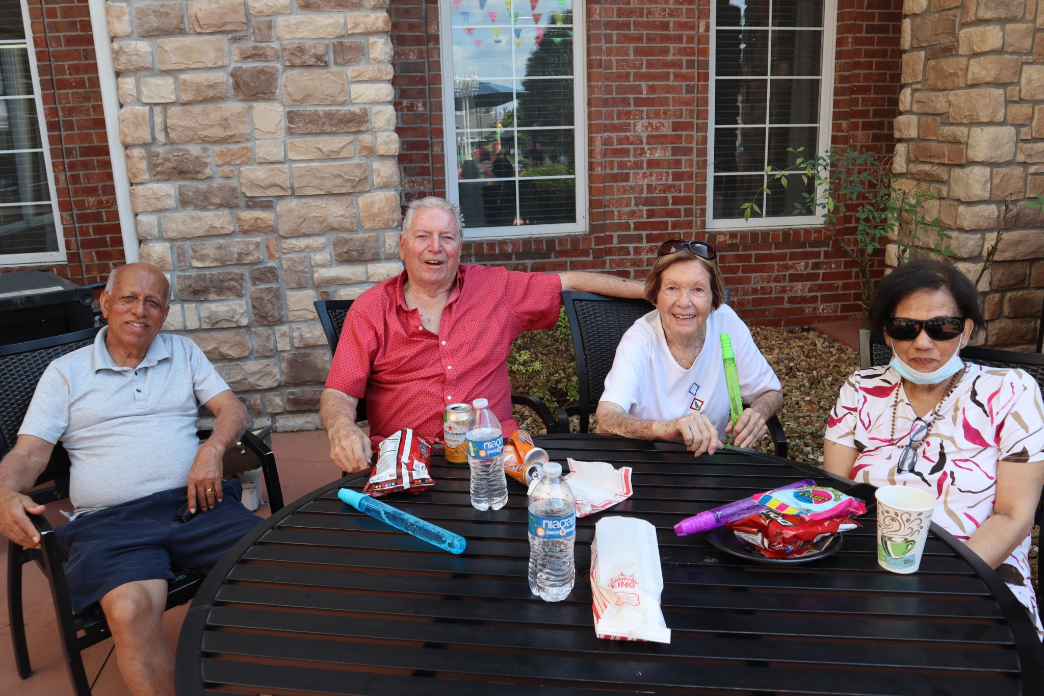 Residents enjoying time outdoors at a table