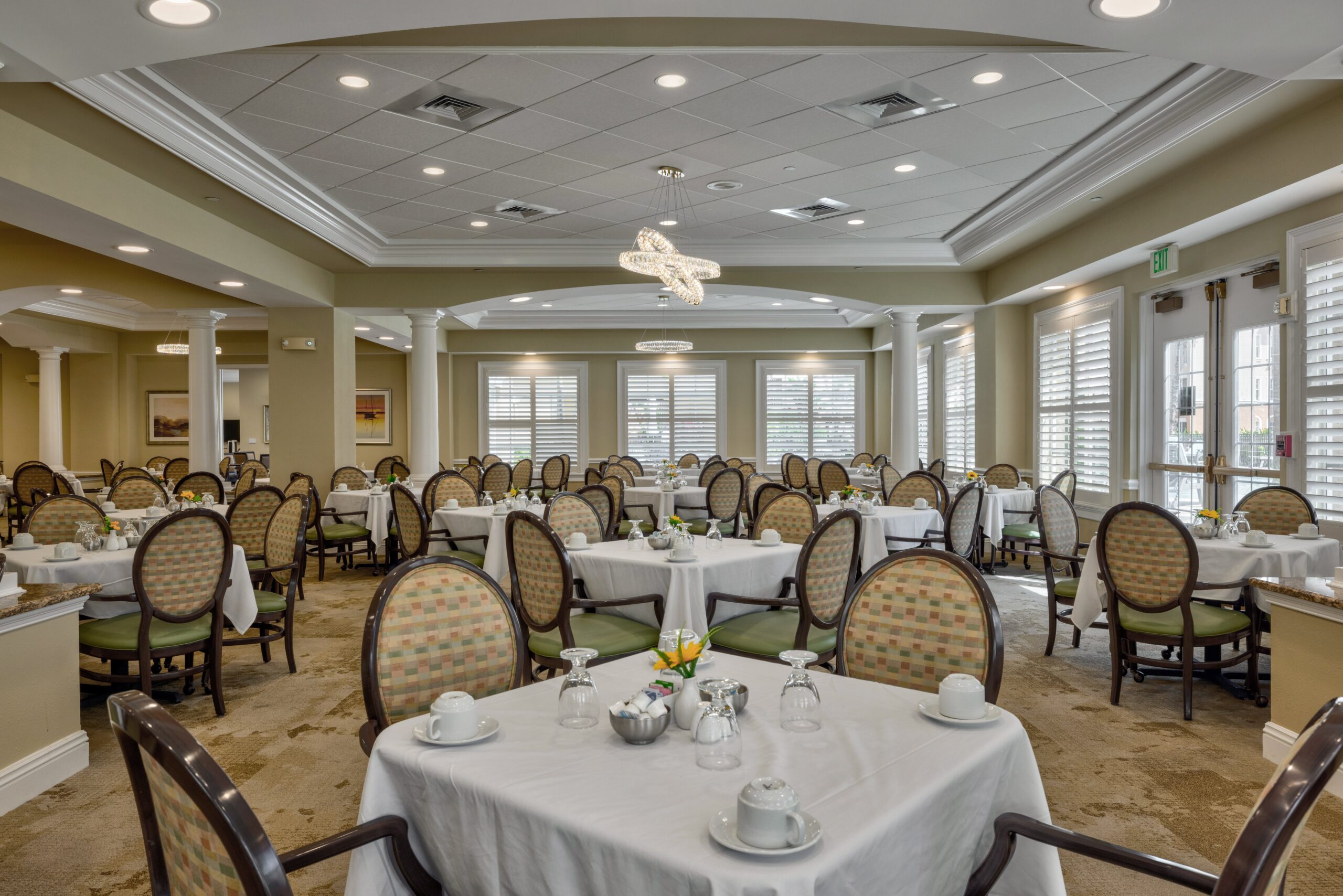 Elegant dining room setup with tables and chairs