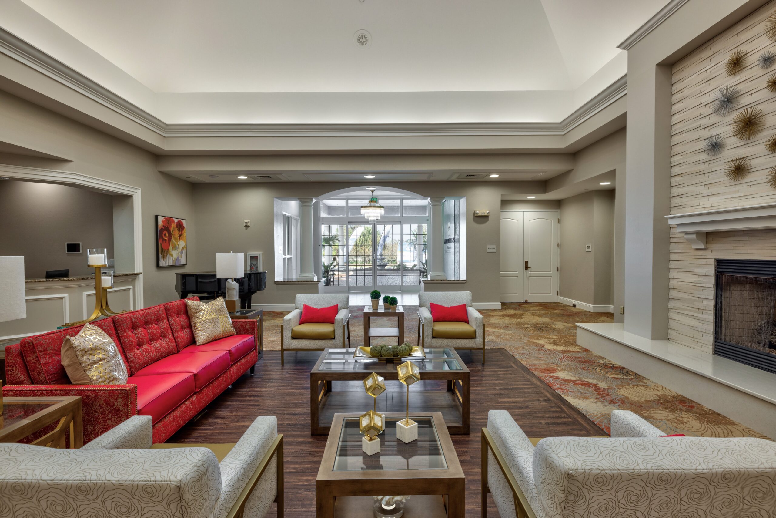 Bright interior common area with seating and piano