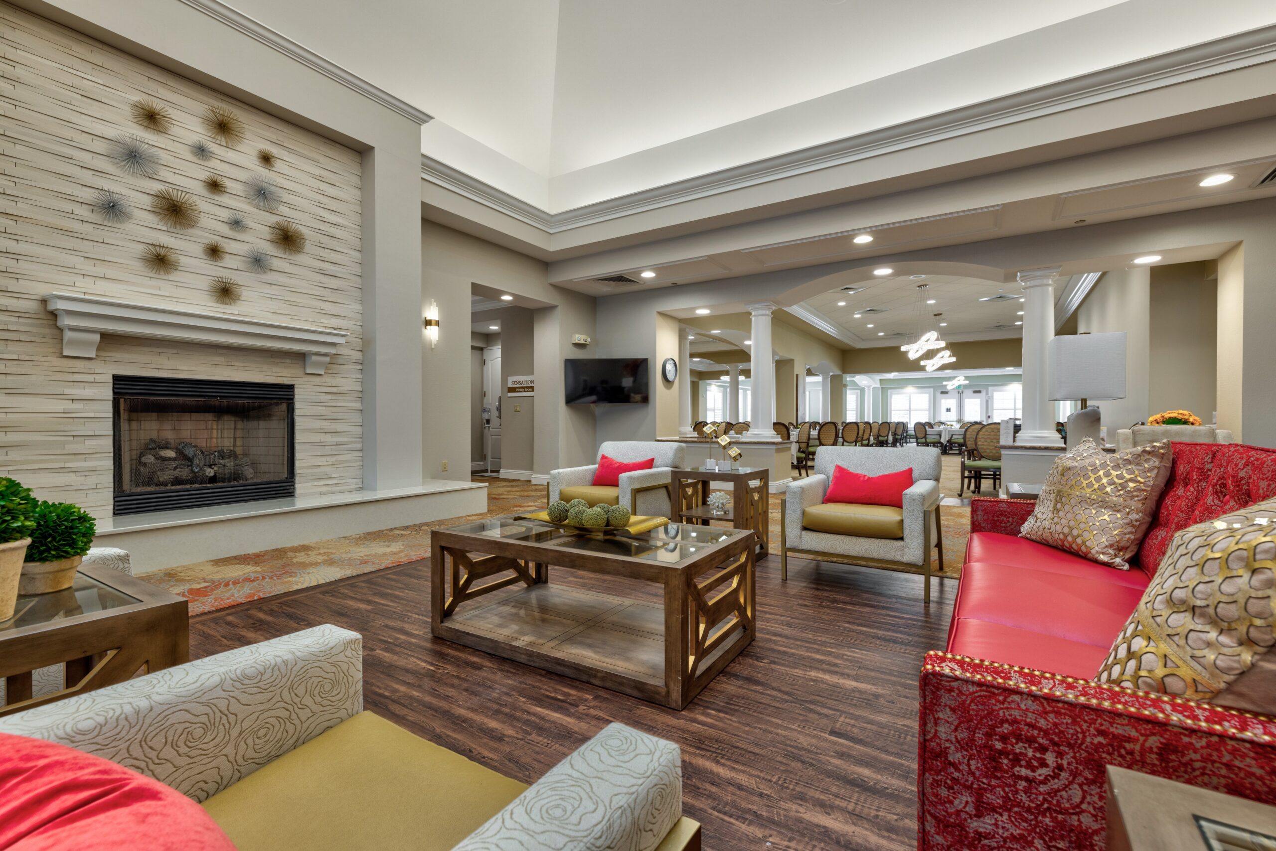Bright and inviting common area with seating and fireplace