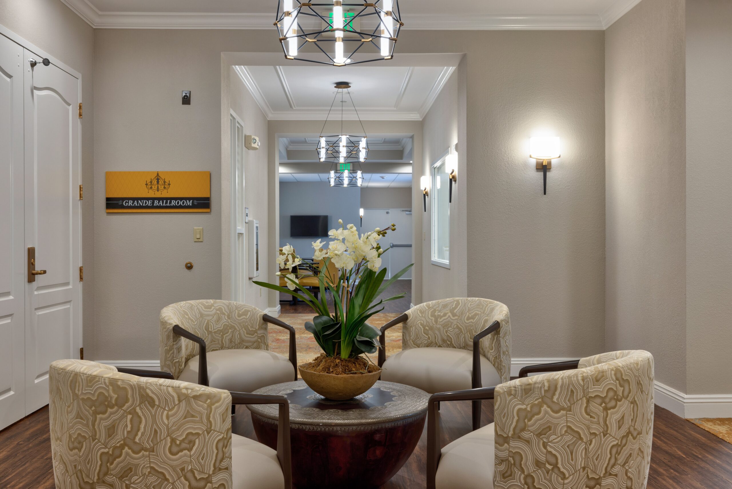 Interior hallway with seating and decorative plants