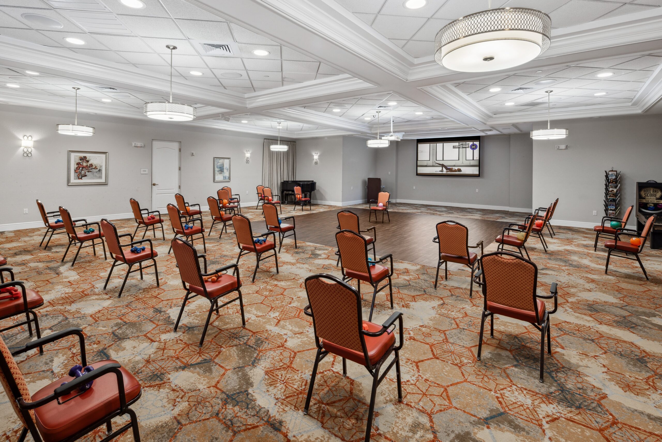 Interior activity room with spaced seating arrangements