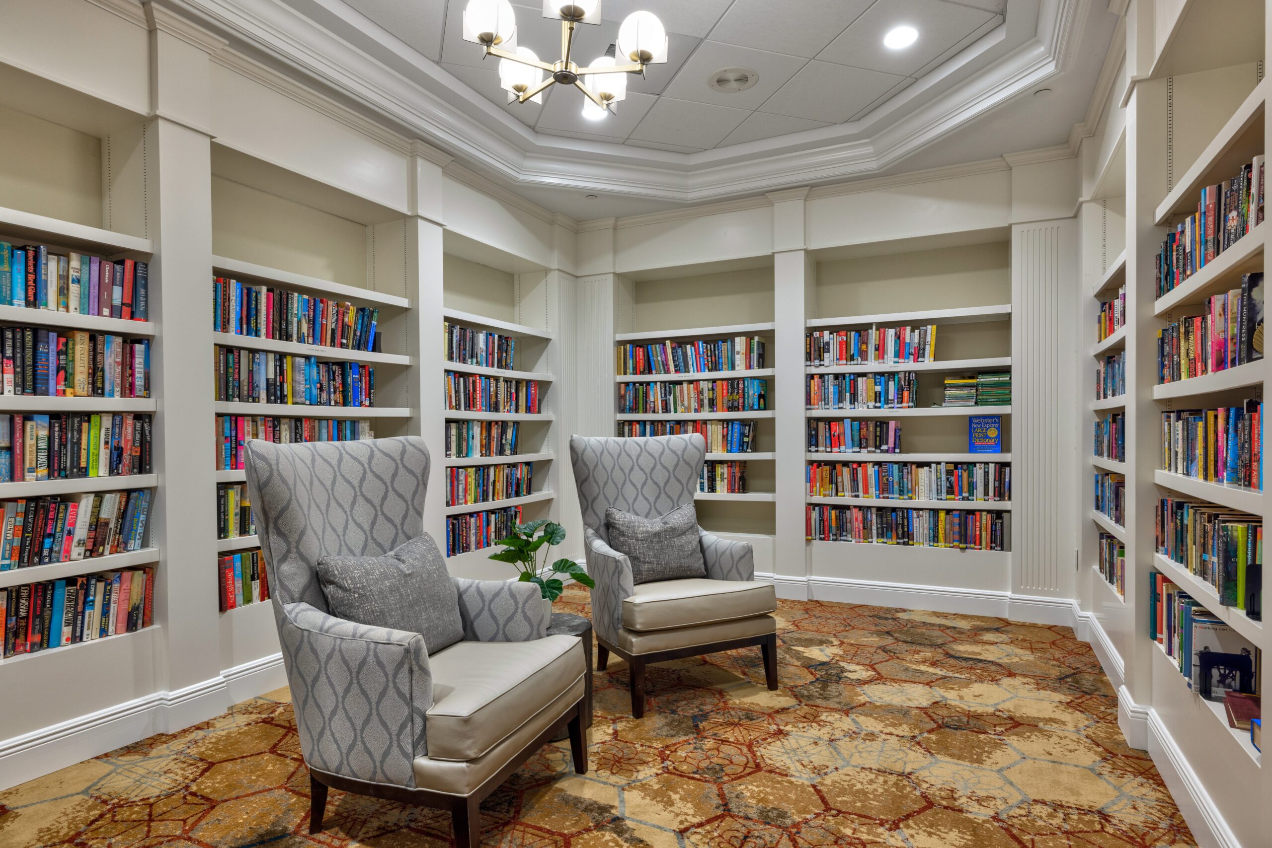 Cozy reading nook with bookshelves and chairs