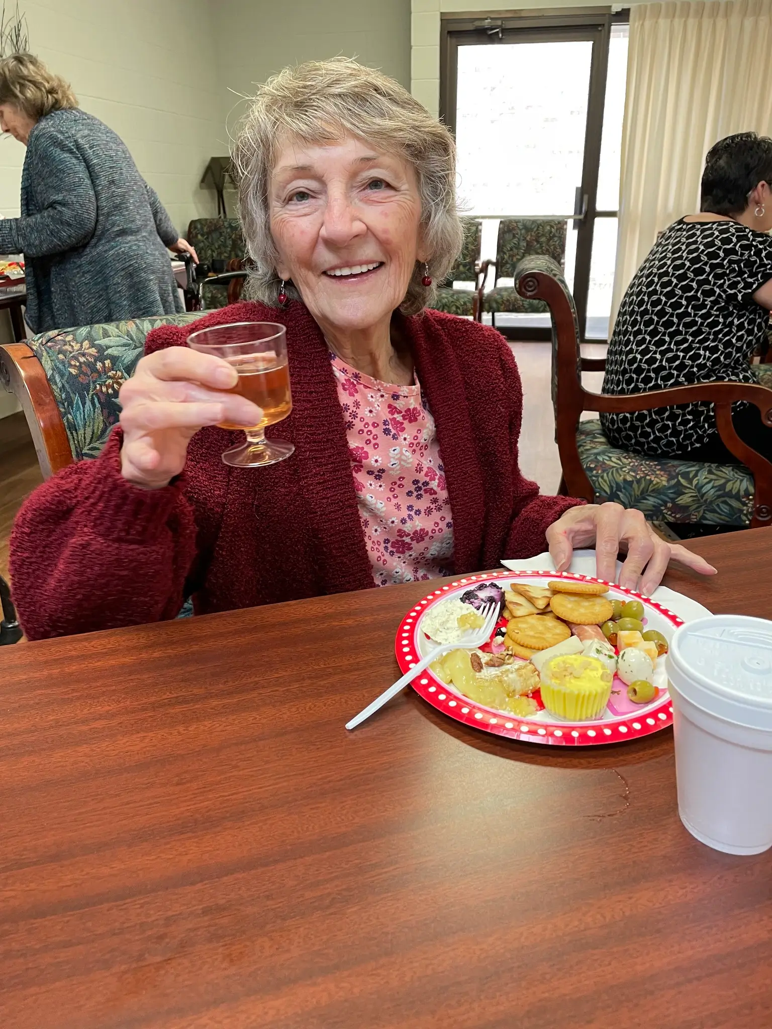 Resident enjoying a meal at the facility dining area
