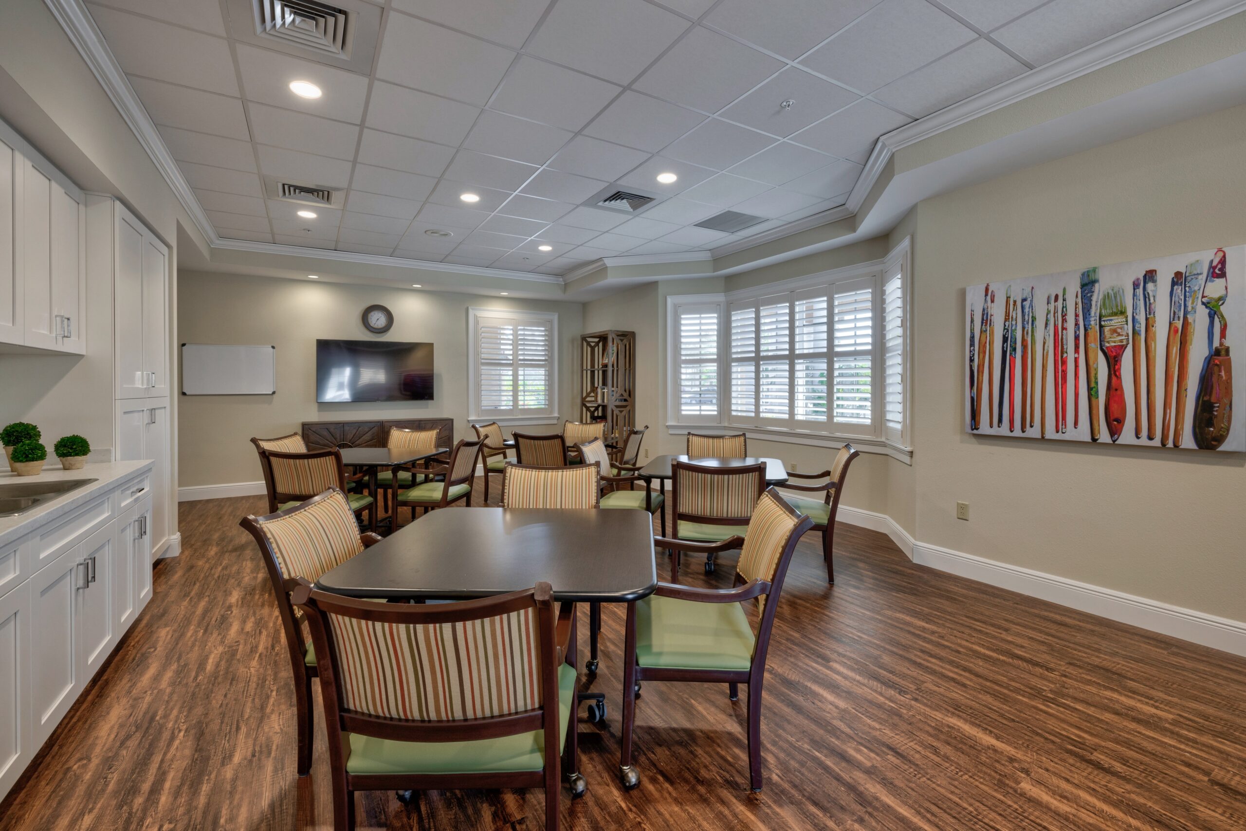 Common area with tables and chairs set up for activities
