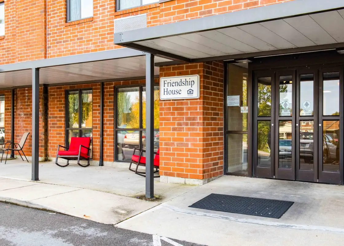 Entrance of the Friendship House with red chairs