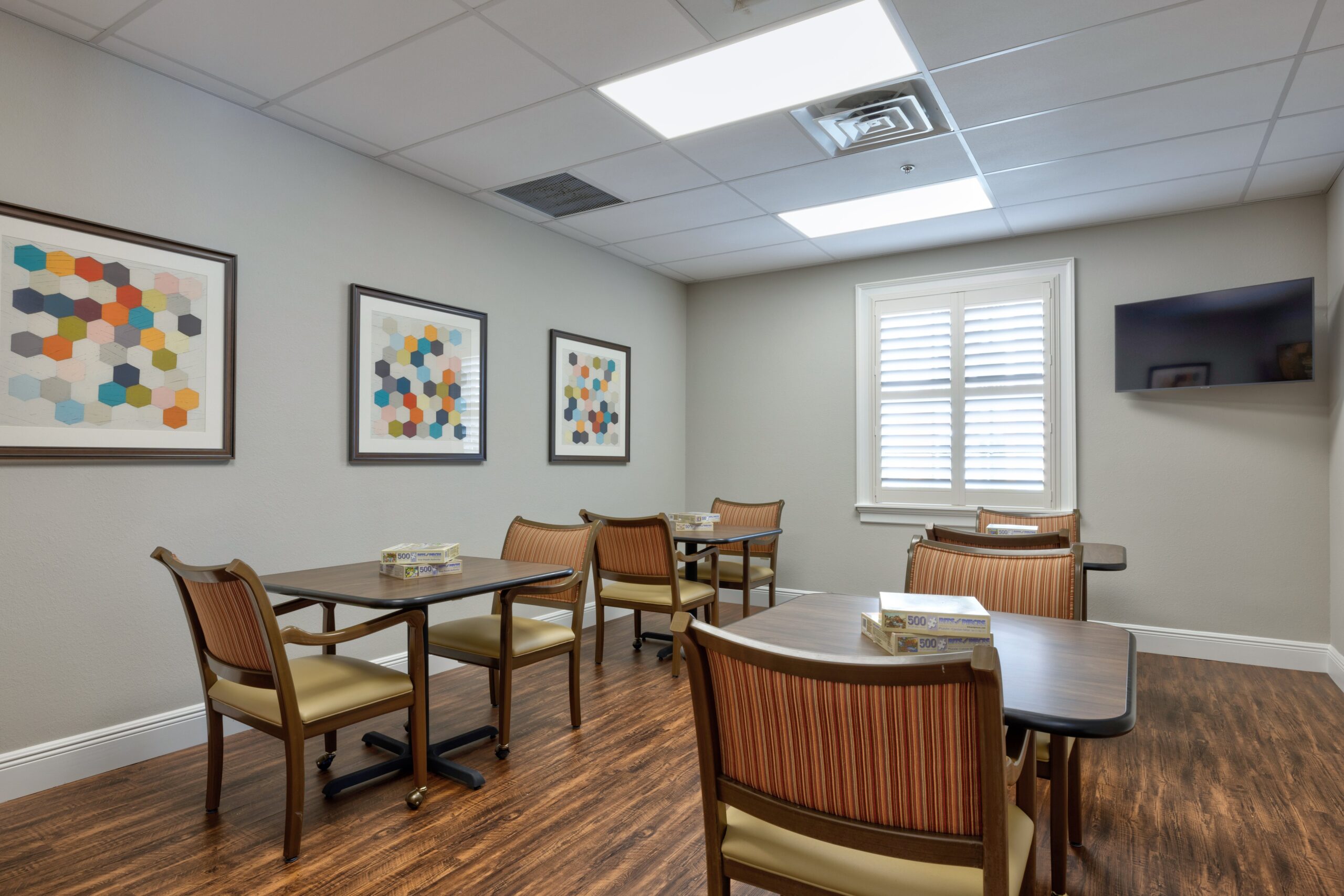 Bright common area with tables and chairs