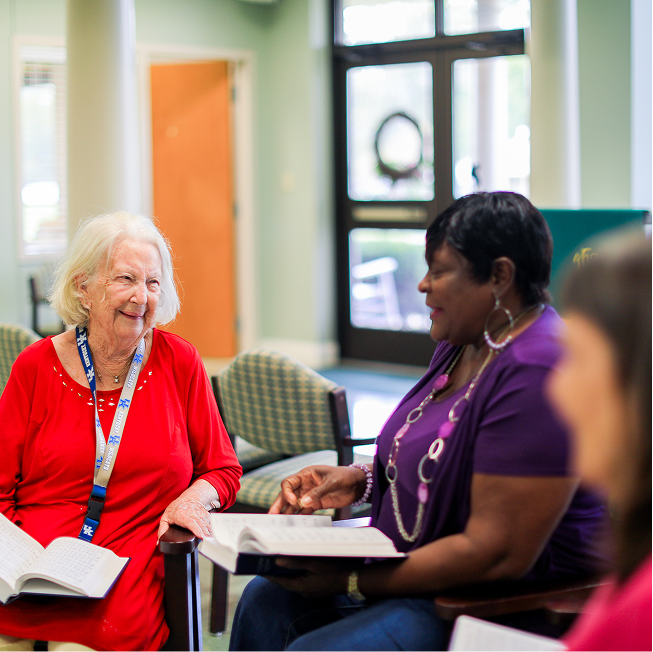 Residents engaging in a community activity in a cozy common area
