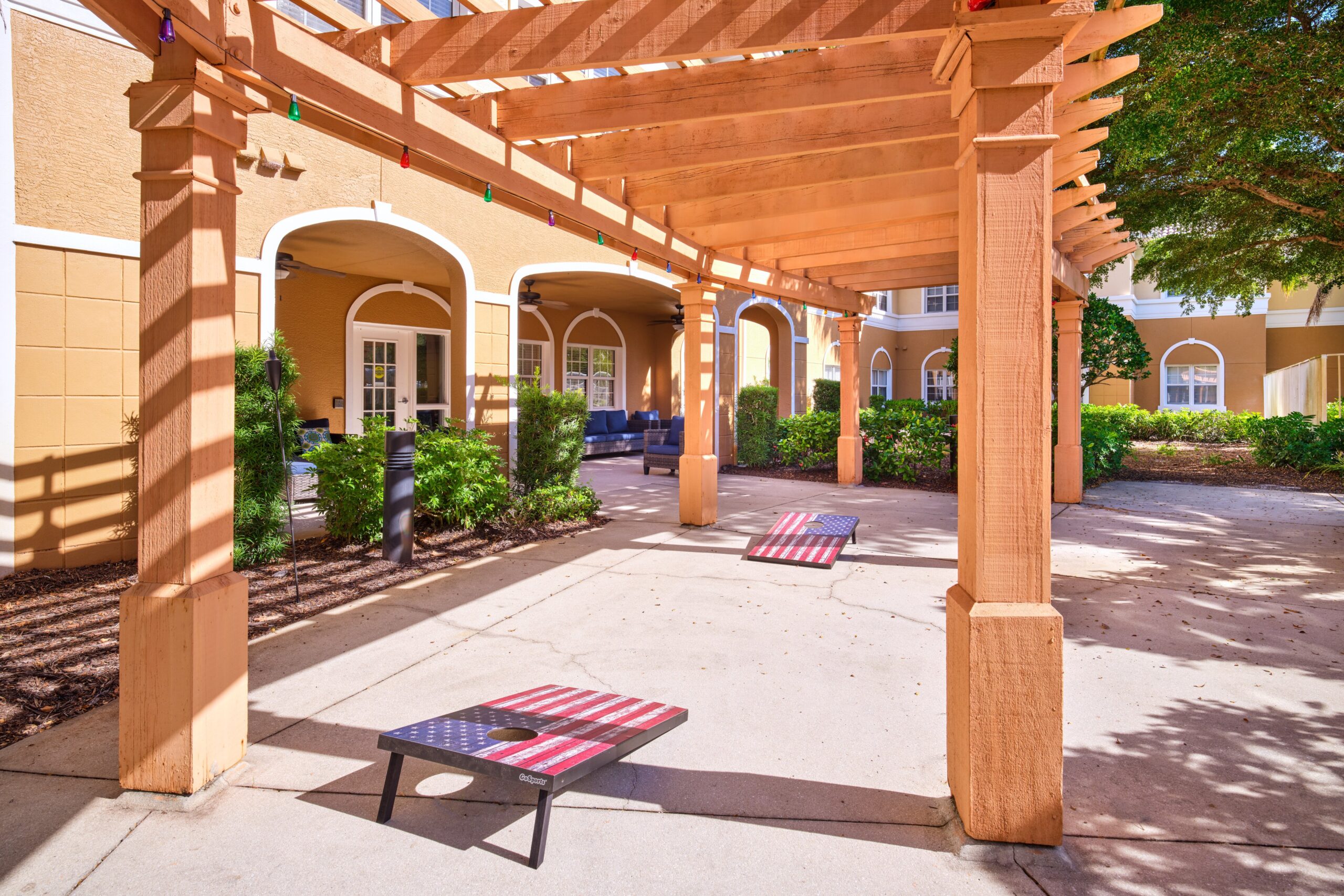 Outdoor seating area with pergola and benches