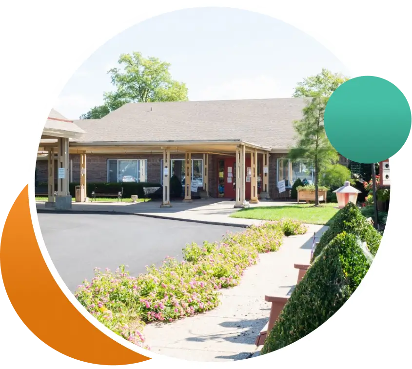 Exterior view of a senior care facility with landscaping.