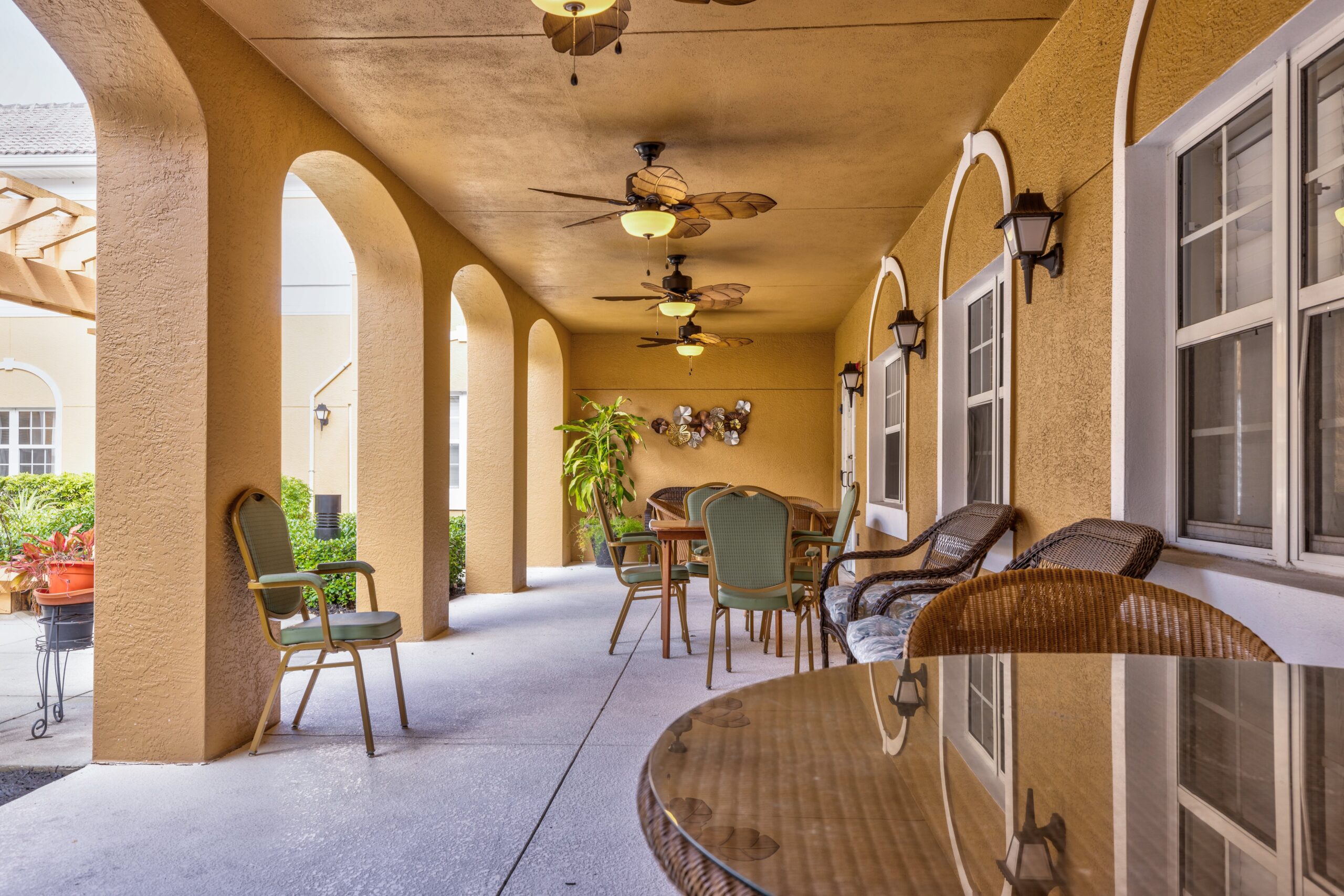 Outdoor seating area with fans and decor