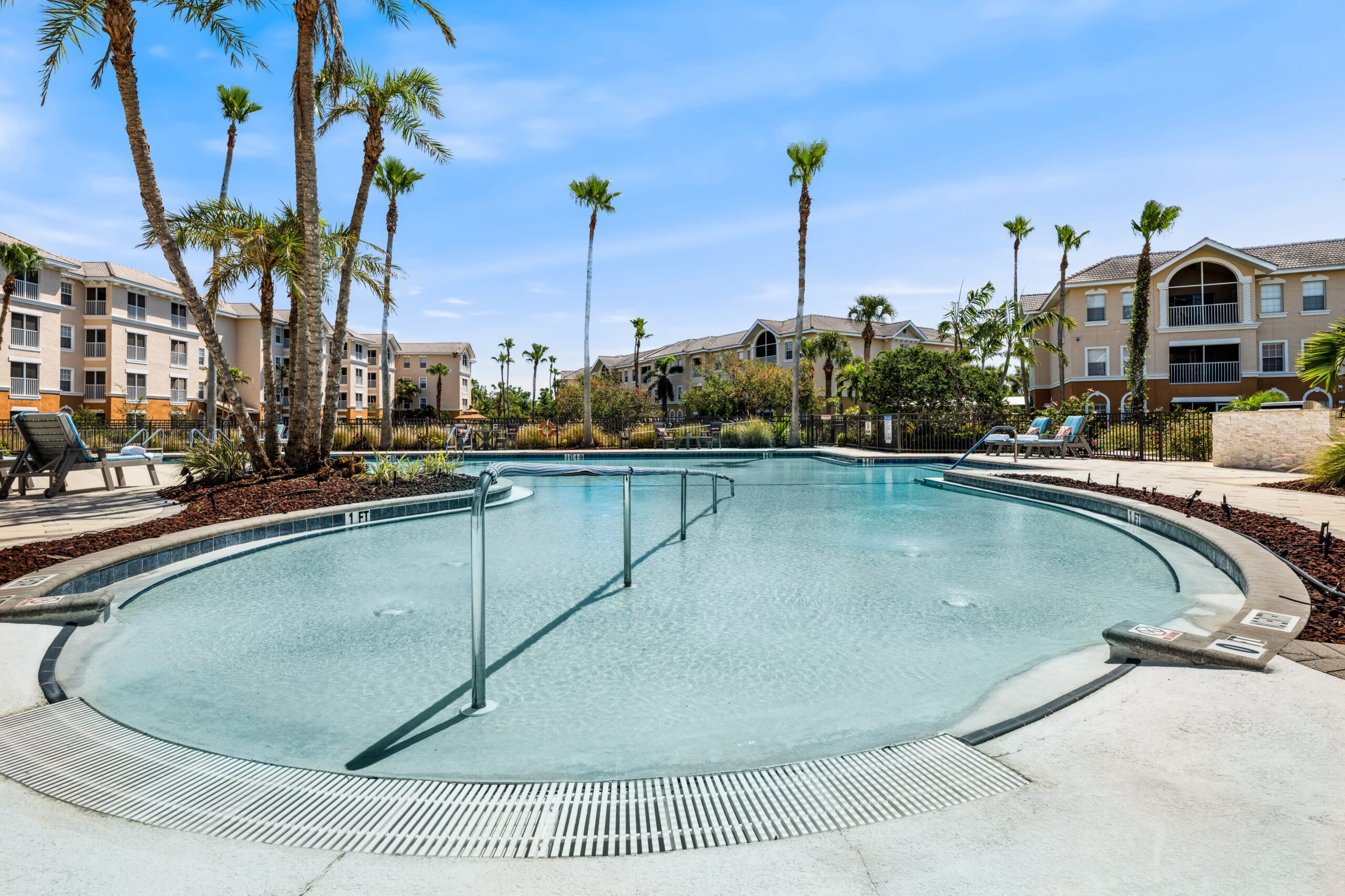 Swimming pool area with palm trees