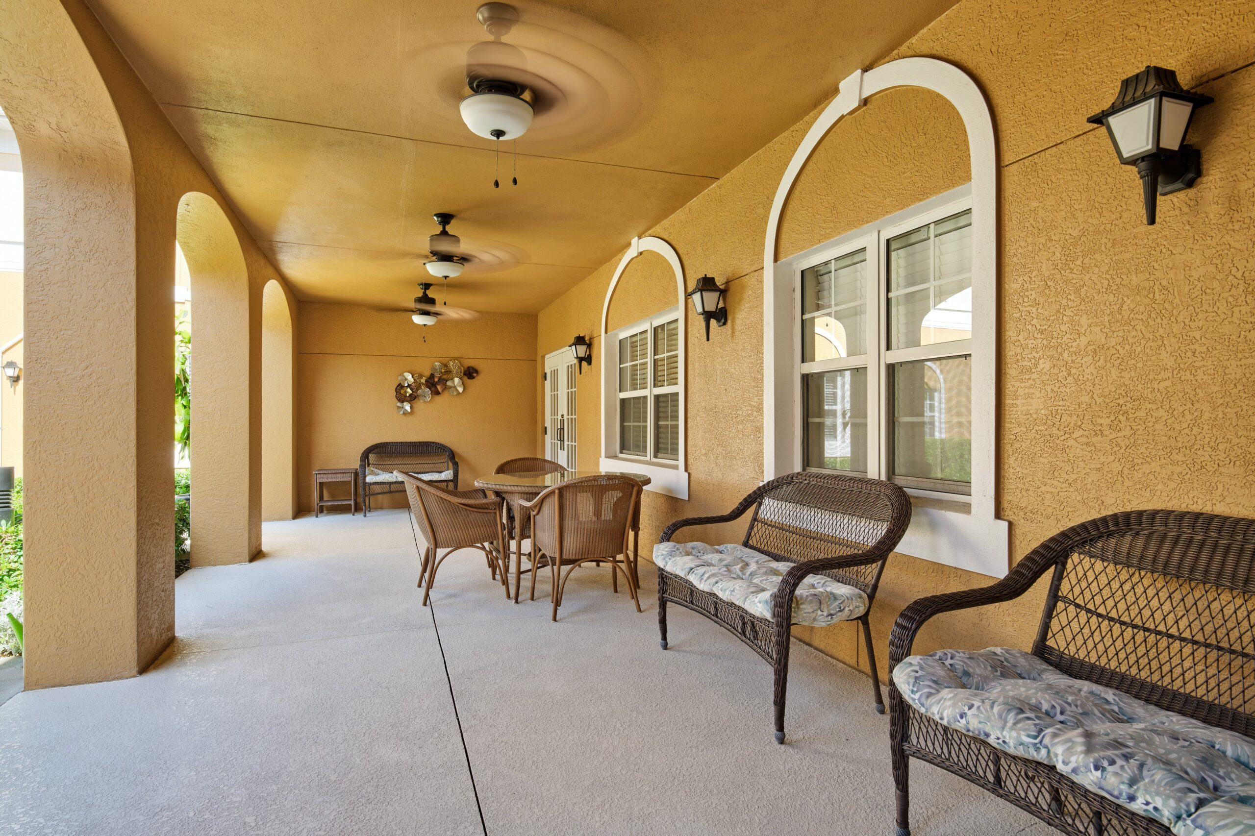Outdoor seating area with wicker chairs and table