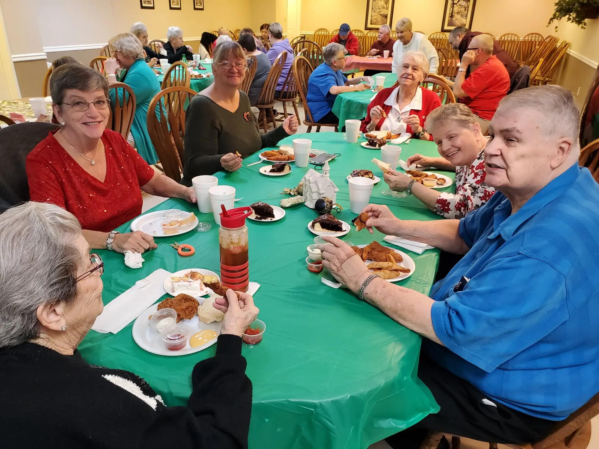 Residents enjoying a meal together in the dining room