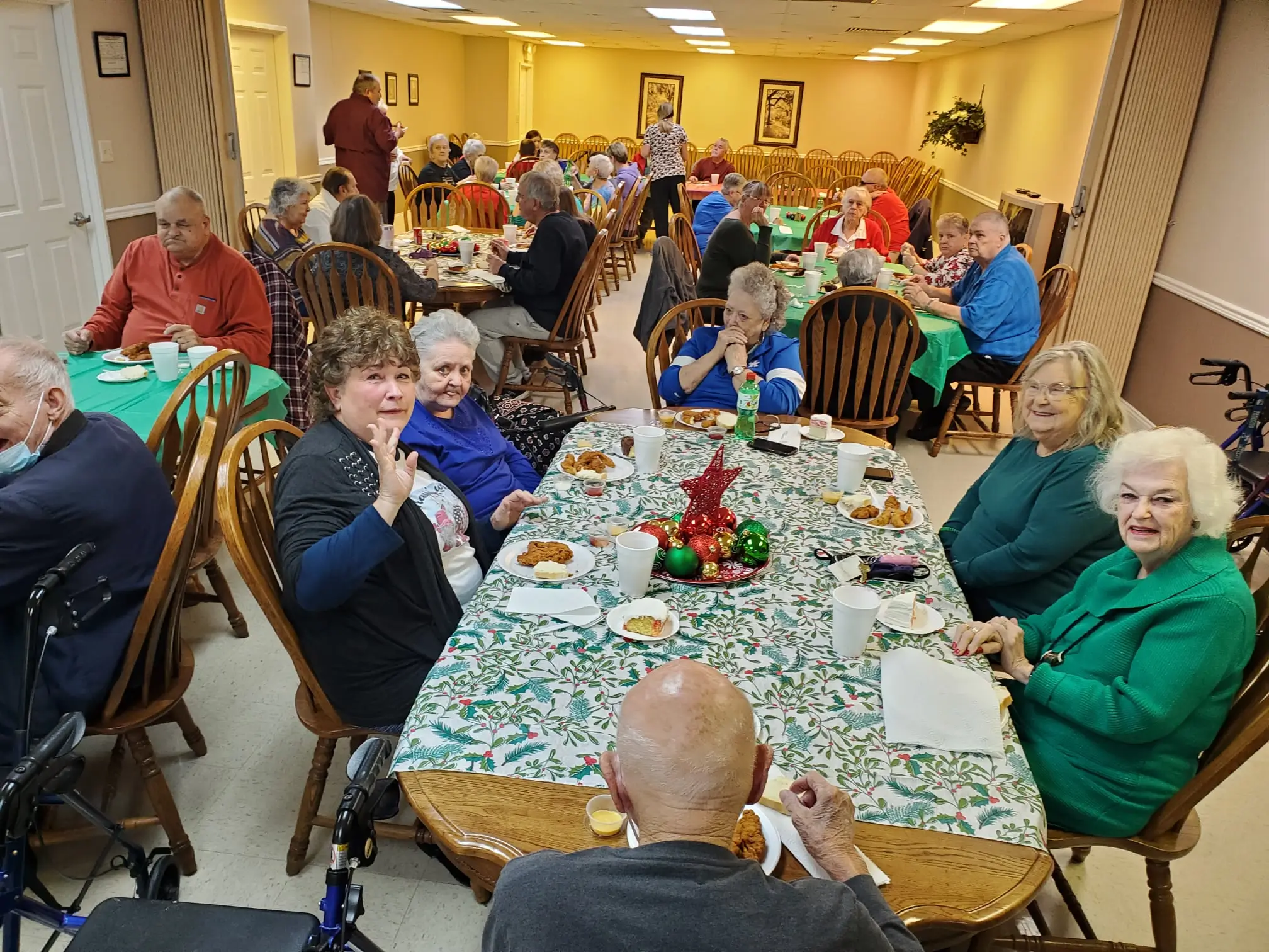 Residents enjoying a meal together in the dining room
