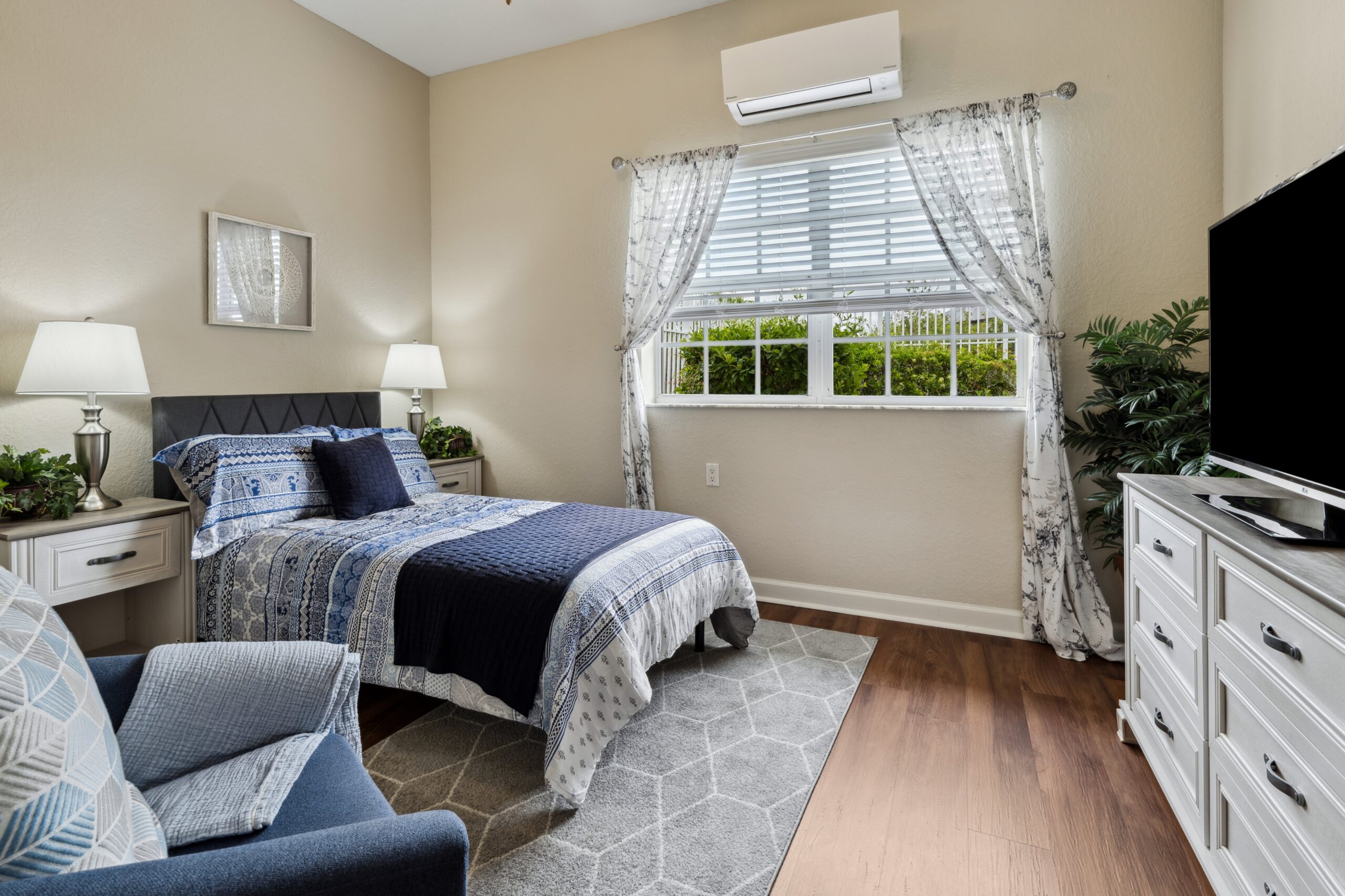 Cozy resident room with a bed and seating area