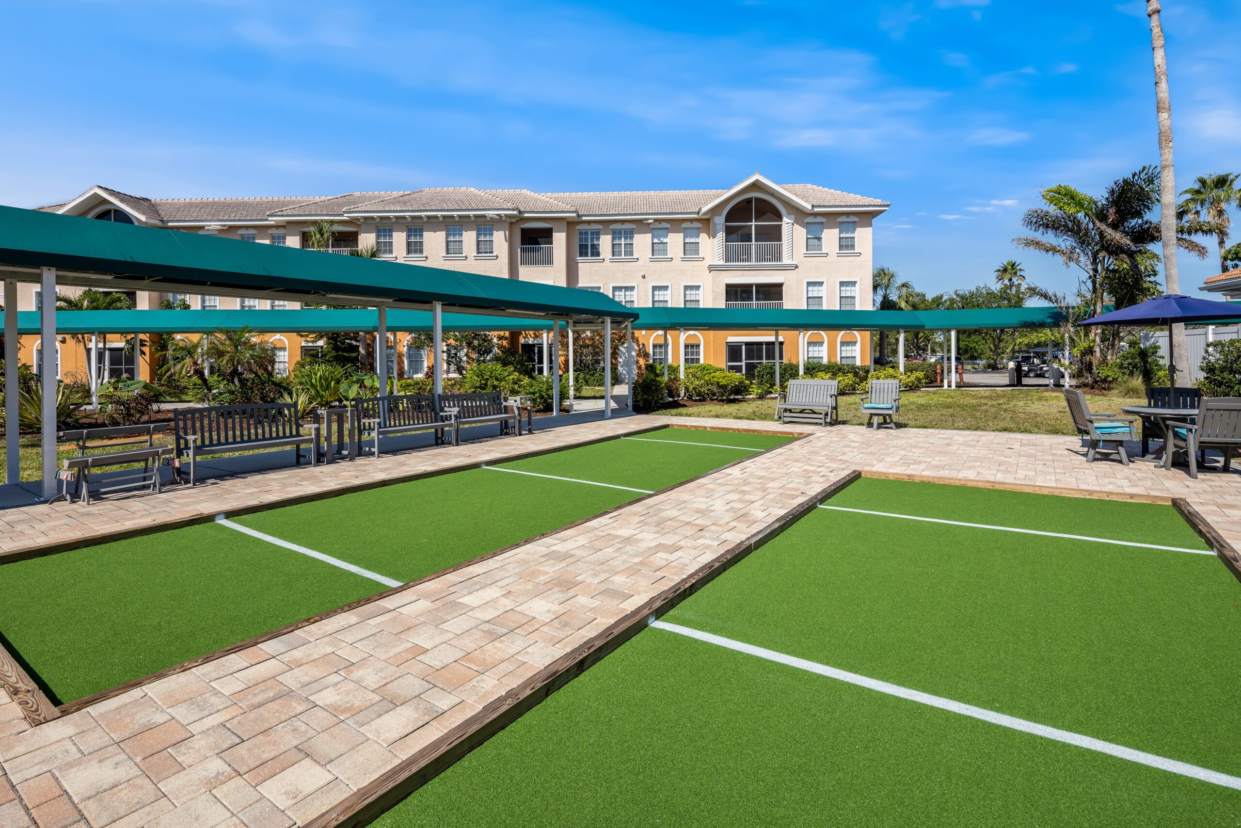 Outdoor space with green lawn and seating area