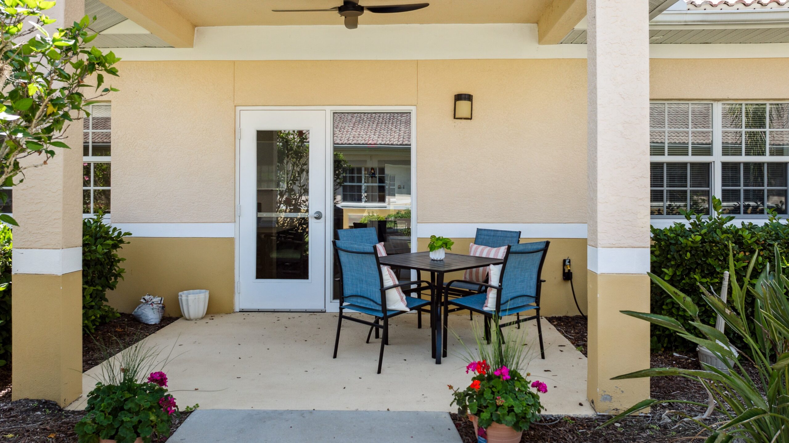 Outdoor patio area with seating and plants