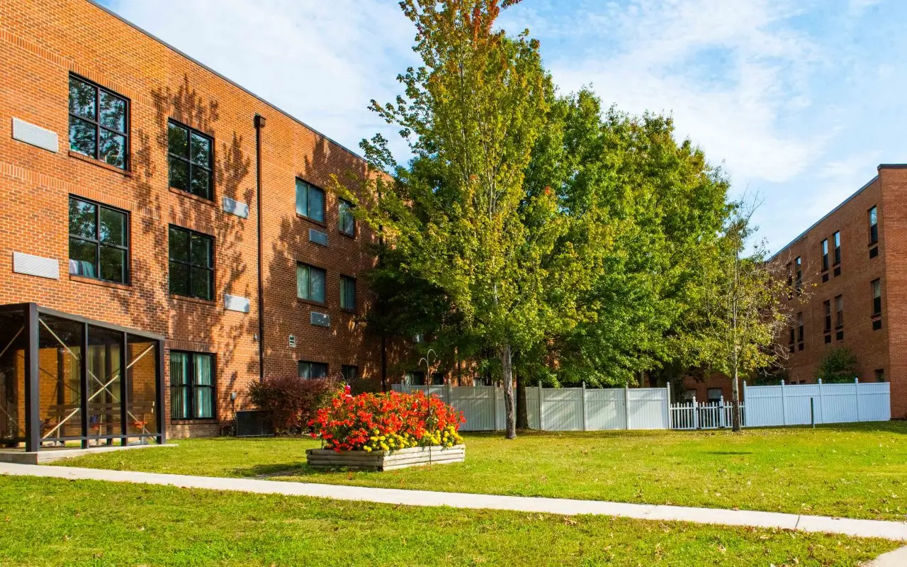 Exterior view of the facility with gardens and landscaping