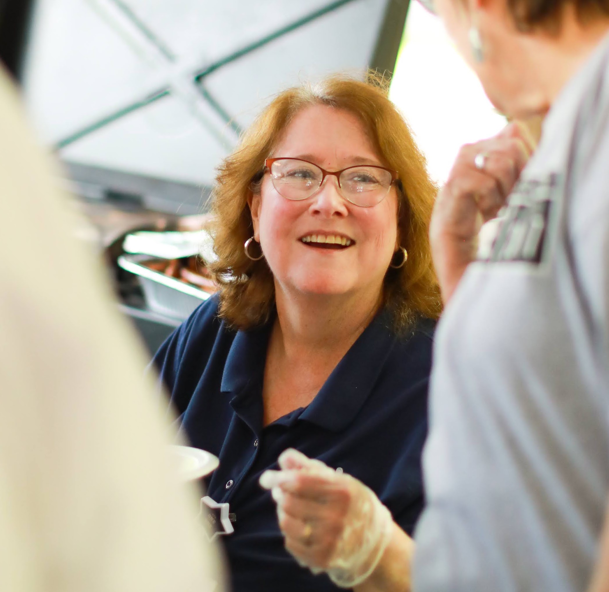 Staff member engaging with residents at an event