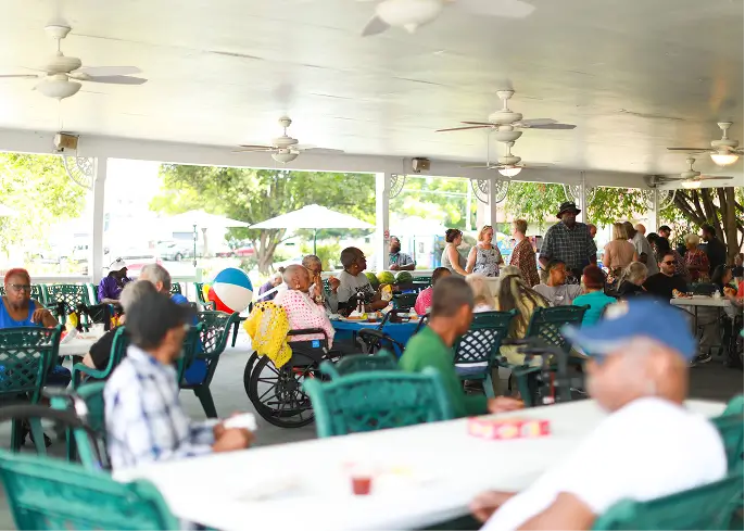 Residents enjoying activities in a spacious outdoor area