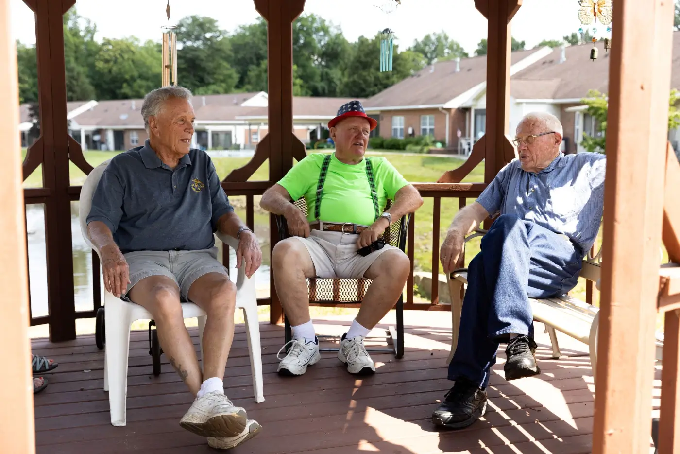 Residents enjoying conversation on a gazebo